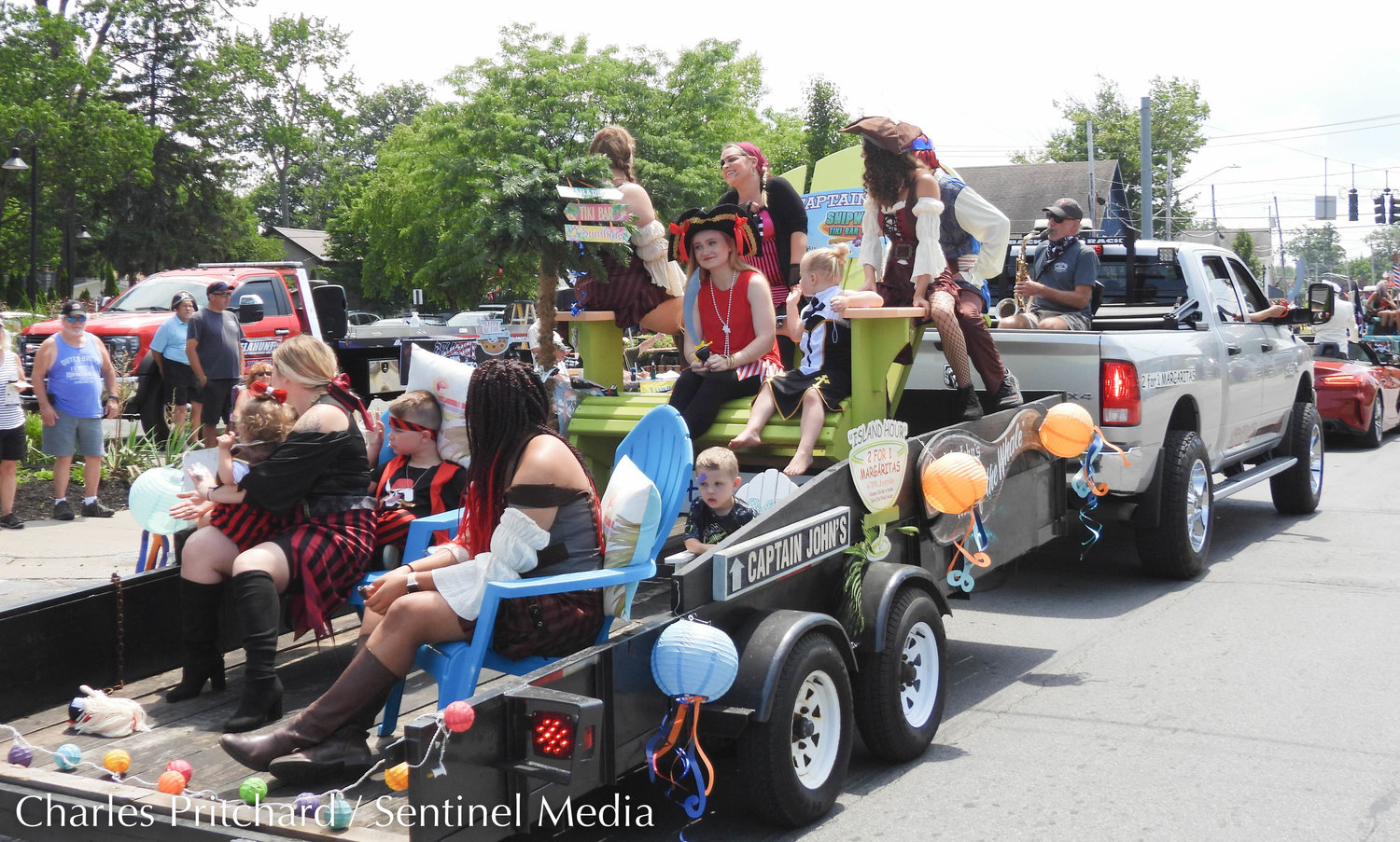 The Sylvan Beach Pirate's Parade makes its way down Main Street. Pictured are employees of Captain John's restaurant in Sylvan Beach.