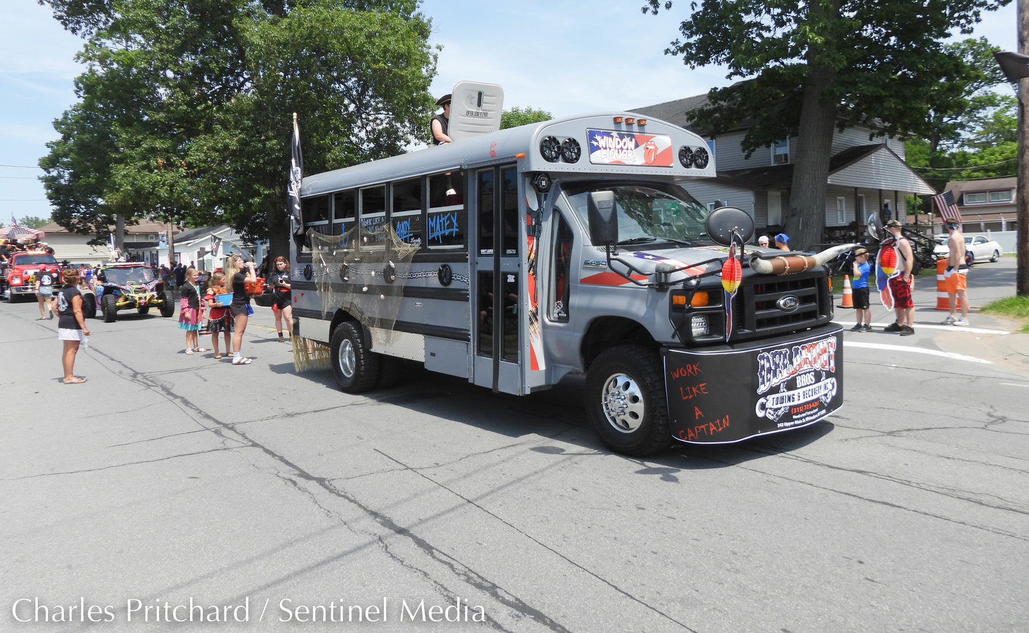 The Sylvan Beach Pirate's Parade makes its way down Main Street. Pictured is the pirate bus of Delahunt Bros. Towing and Recovery in Yorkville.