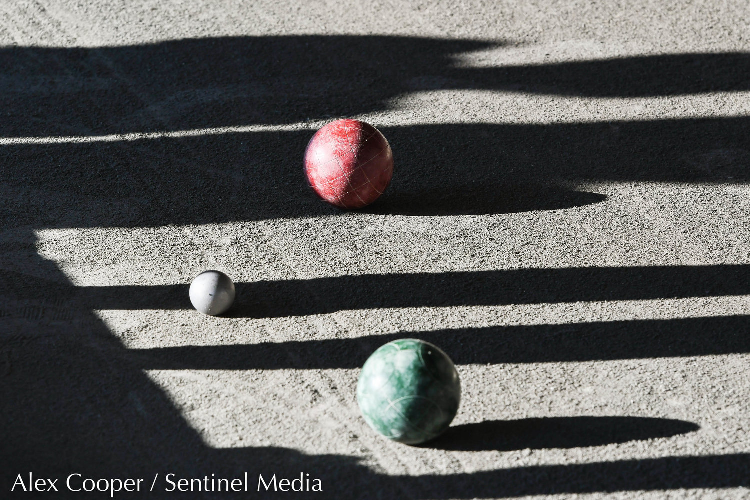 Players shadows cast in the pit during the opening of the womens matches of the World Series of Bocce on Thursday at the Toccolana Club in Rome.