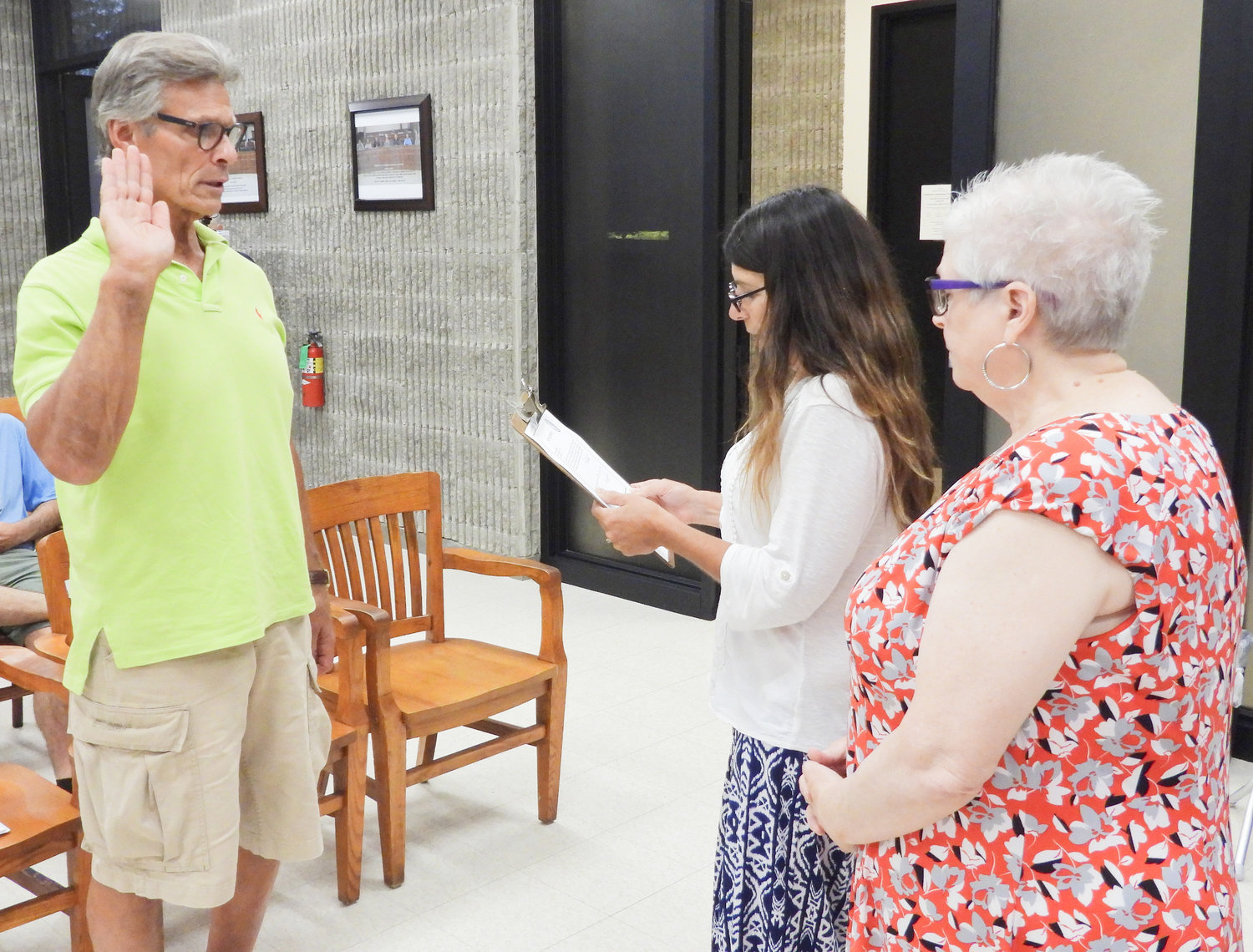 Jim Szczerba, left, is sworn in as the new Ward 1 councilor following the departure of Gary Reisman. Reisman sold his house and no longer lives in Ward 1 but still lives in Oneida, according to Mayor Helen Acker.