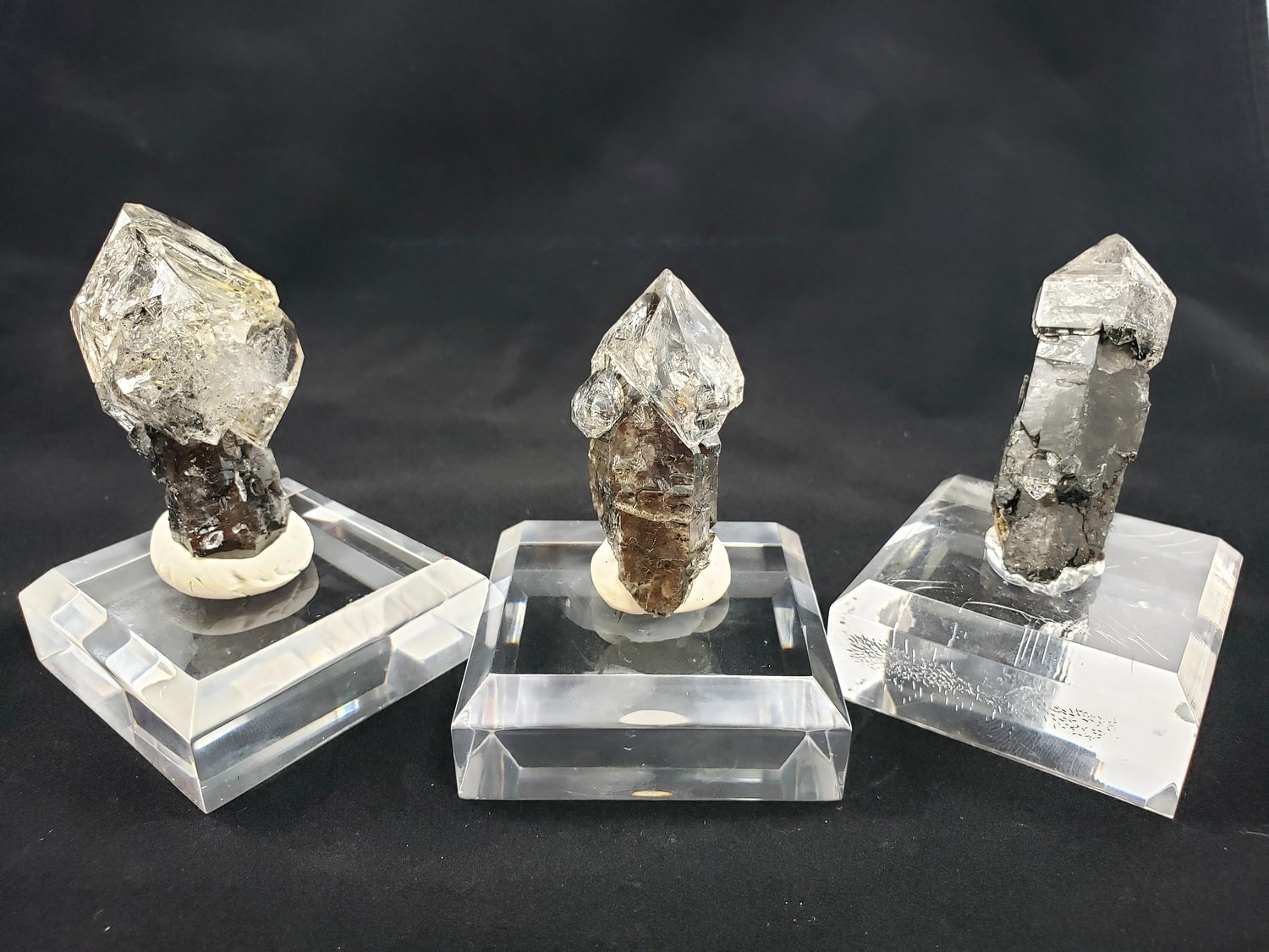 Rare Herkimer Diamond quartz crystal formations, including black-stemmed scepters, can be found at Diamond Mountain Mining in Little Falls.