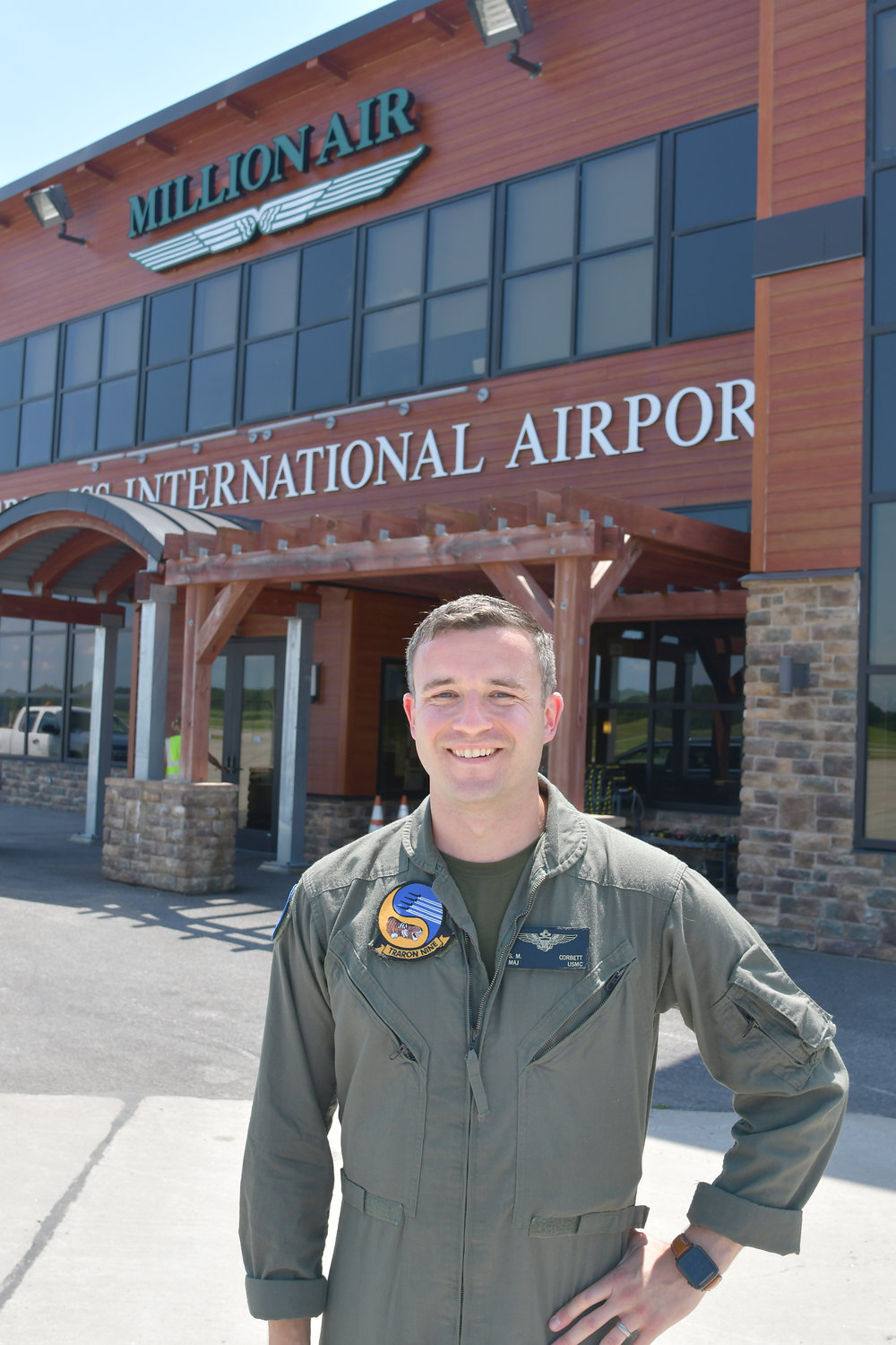 Major Scott Corbett stands in front of Million Air at the Griffiss International Airport.  Major Corbett is a Marine pilot instructor conducting training at Griffiss.