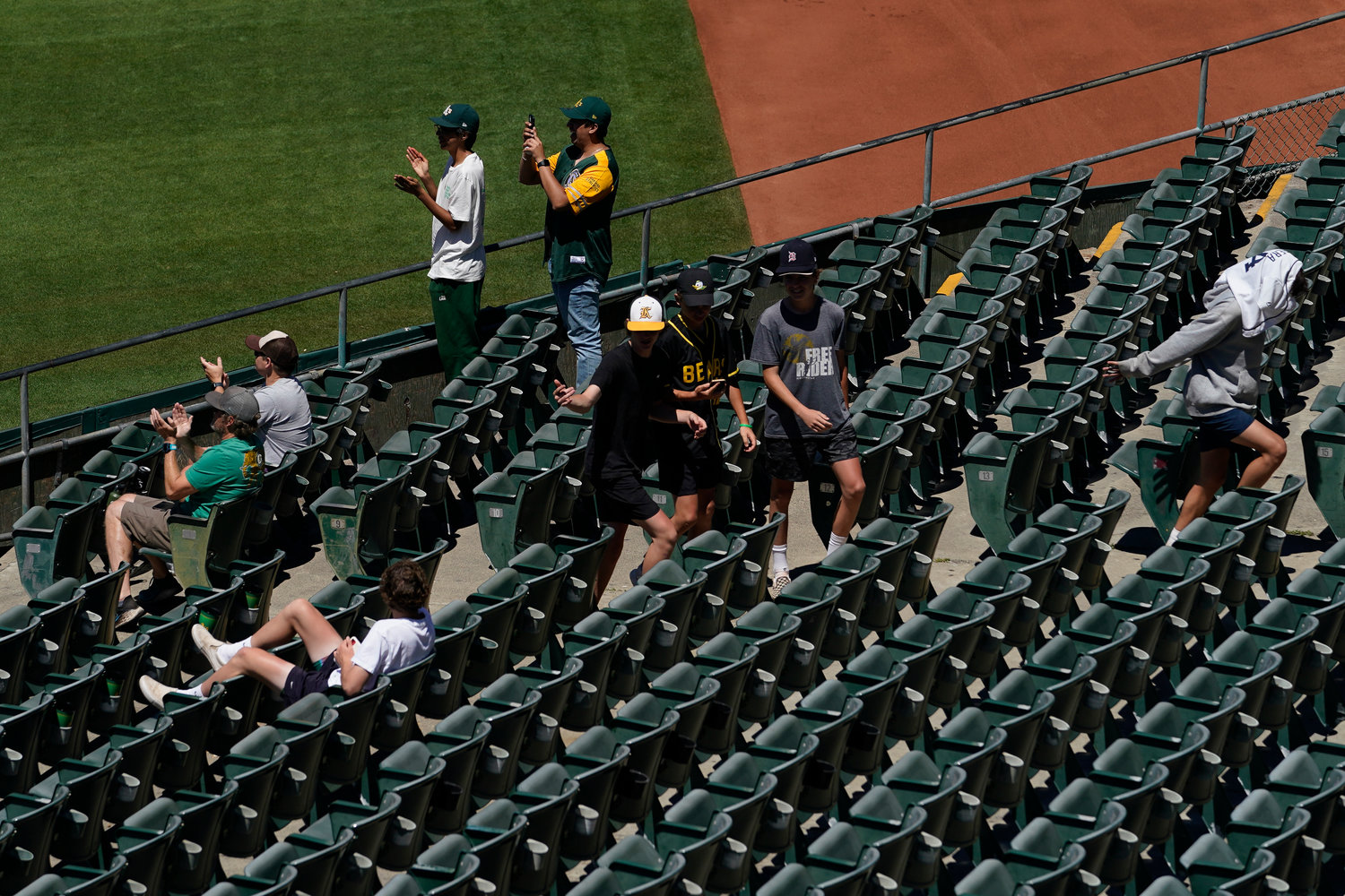 Fans attend the first baseball game of a doubleheader between the Oakland Athletics and the Detroit Tigers in Oakland, Calif., Thursday, July 21, 2022. (AP Photo/Godofredo A. V√°squez)
