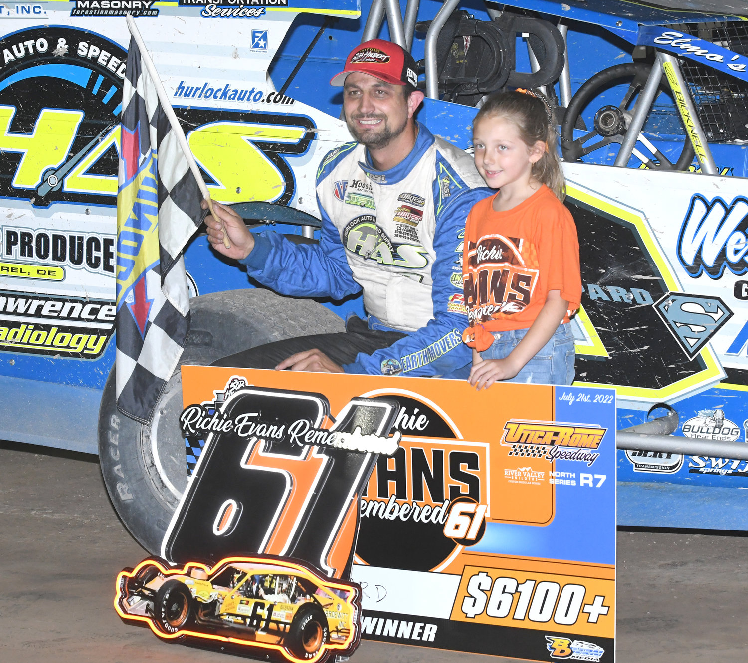 VICTORY LANE CELEBRATION — Matt Sheppard of Savannah celebrates with the great grand-daughter of Richie Evans, Grace Smith, 8, in victory lane Thursday night after winning the 61-lap Richie Evans Remembered feature race at Utica-Rome Speedway.