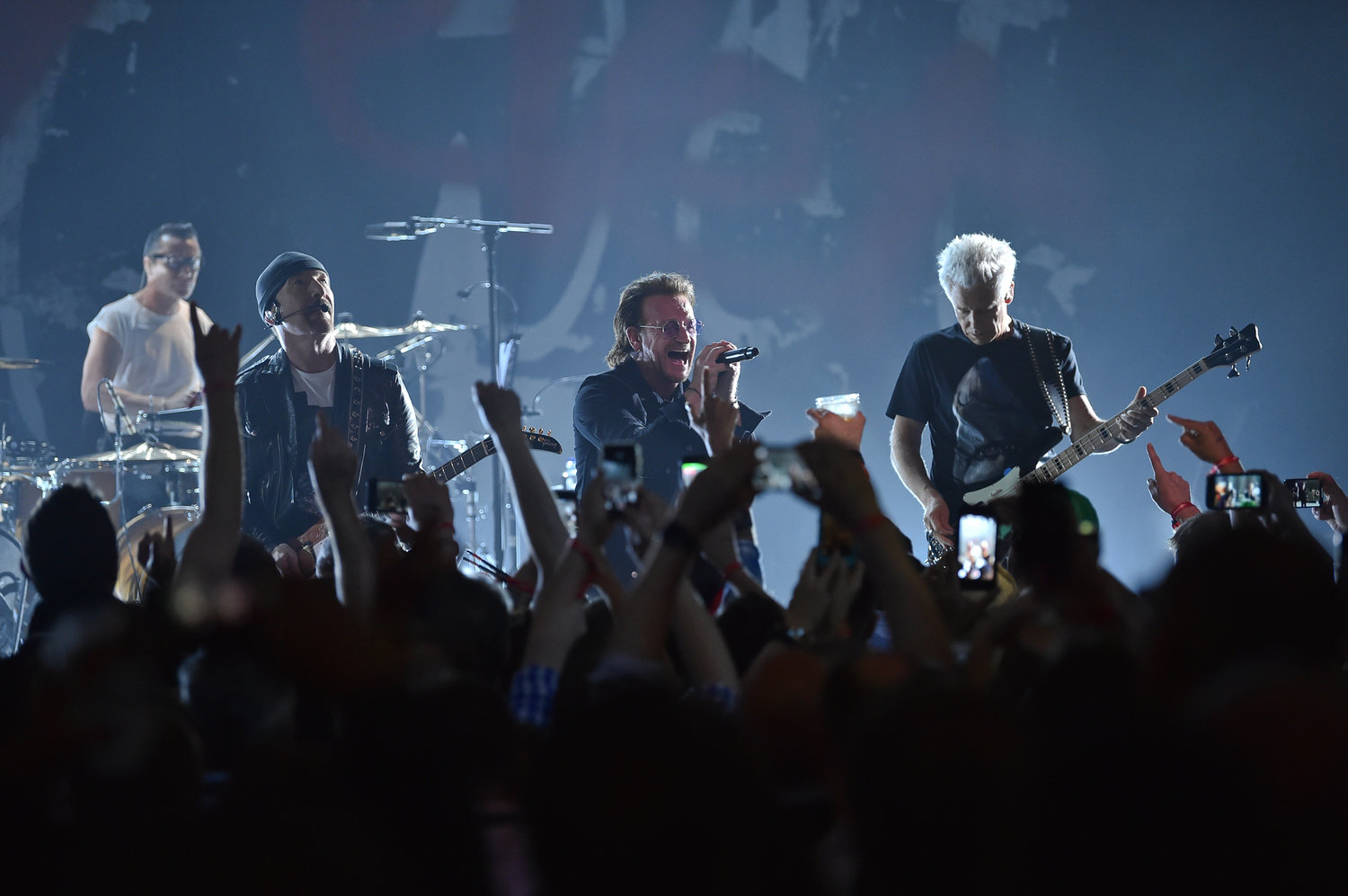 Larry Mullen Jr, left, The Edge, Bono and Adam Clayton of U2 perform during a concert at the Apollo Theater hosted by SiriusXM on June 11, 2018, in New York.