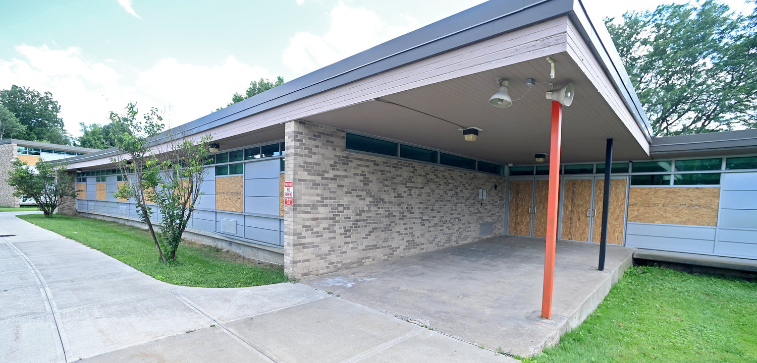 The front doors and windows at Staley Elementary School are currently boarded up.