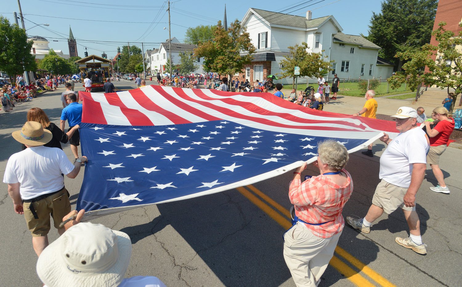 Rome Rotary walks the flag south on North James Street during the 2019 Honor America Days parade.