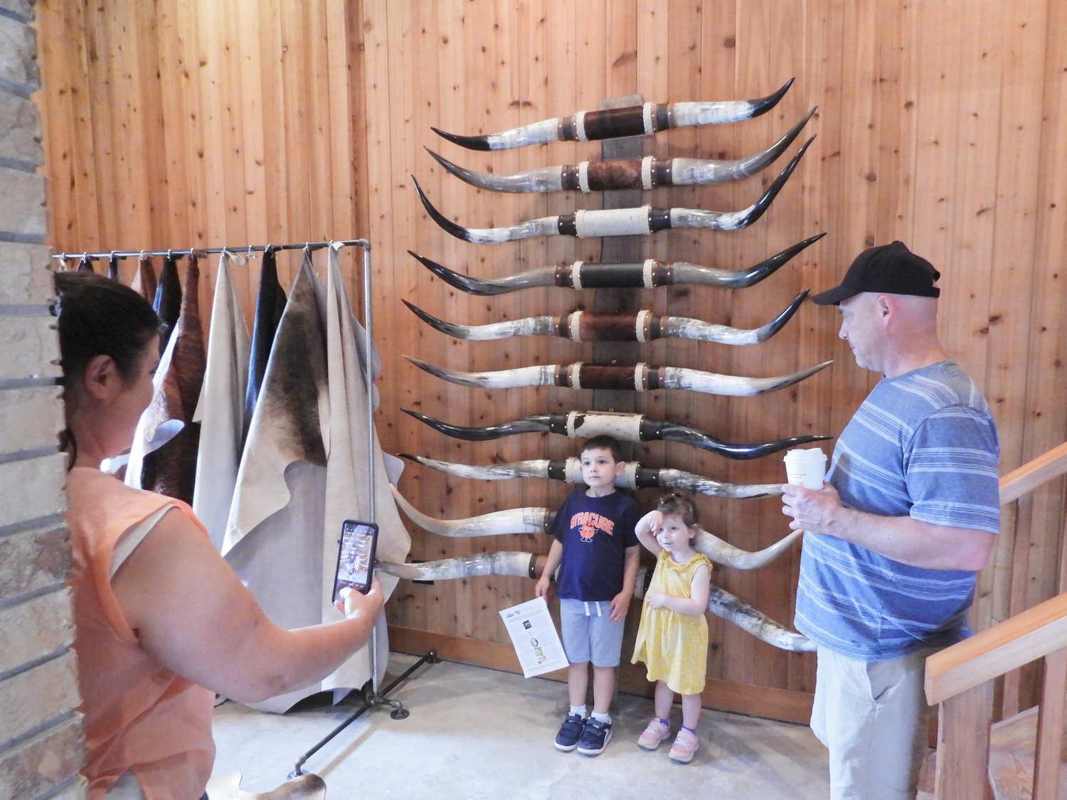 A couple children pose in front of horns for sale at Albanese Longhorns in Cazenovia and get their picture taken. Open Farm Day on Saturday, July 30 saw people from all over visiting their local farms and seeing firsthand what they offer to the community.