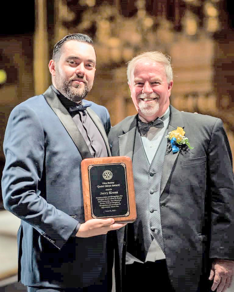 Utica Rotary Club member Jerry Kraus, right, poses with his award with outgoing Club President Stephen Turnbull.