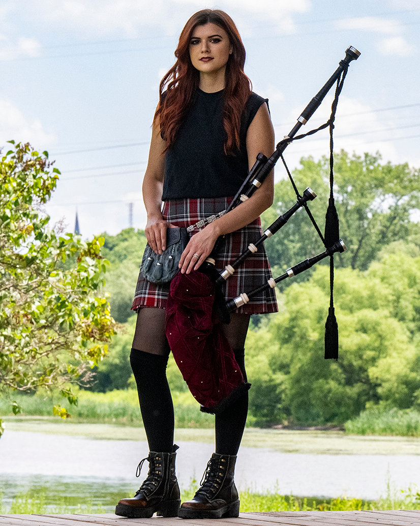 Aly the Piper stands on the stage in Freedom Park in Scotia in this July 2022 photo.