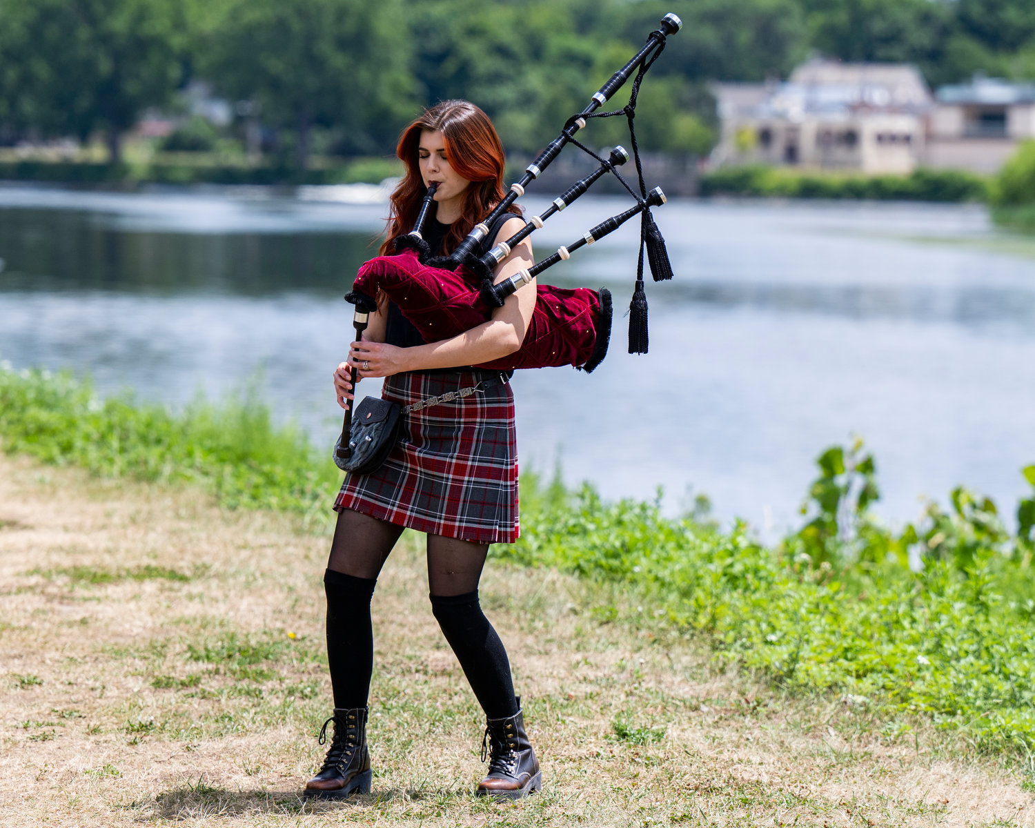 Ally Crowley-Duncan, aka Ally the Piper, plays the bagpipes in Collins Park in Scotia Wednesday, July 13, 2022.
