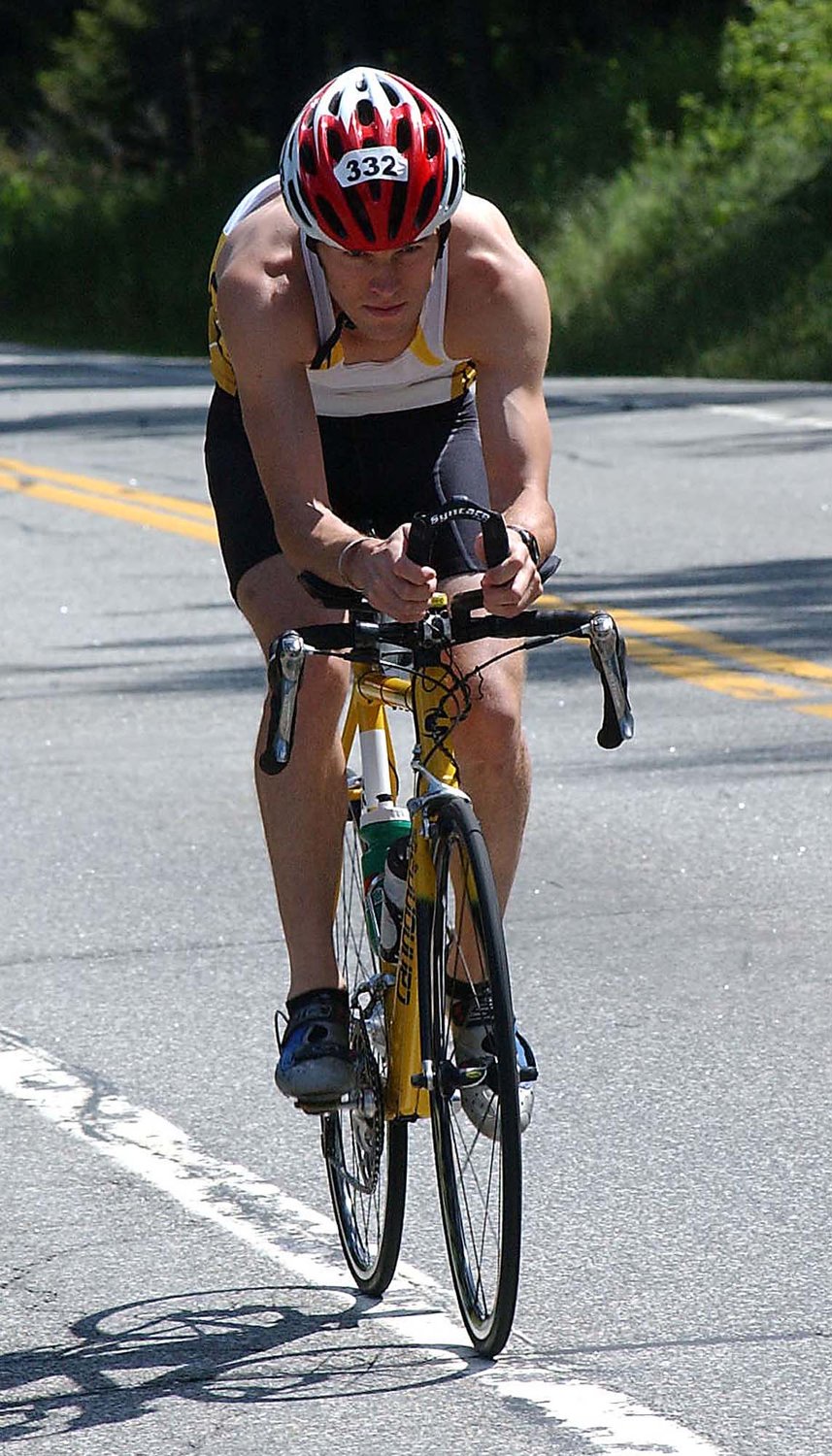 This year will be the 23rd Ironman triathlon in this Lake Placid. A new contract between organizers and the Lake Placid village board allows Ironman to return for two more years — through 2024. In this file photo, Robert Kenney, of Camillus, N.Y., does a little light training in the Wilmington Notch, Saturday, July 23, 2005, for the Ford Ironman USA Lake Placid Triathlon in Lake Placid, N.Y.