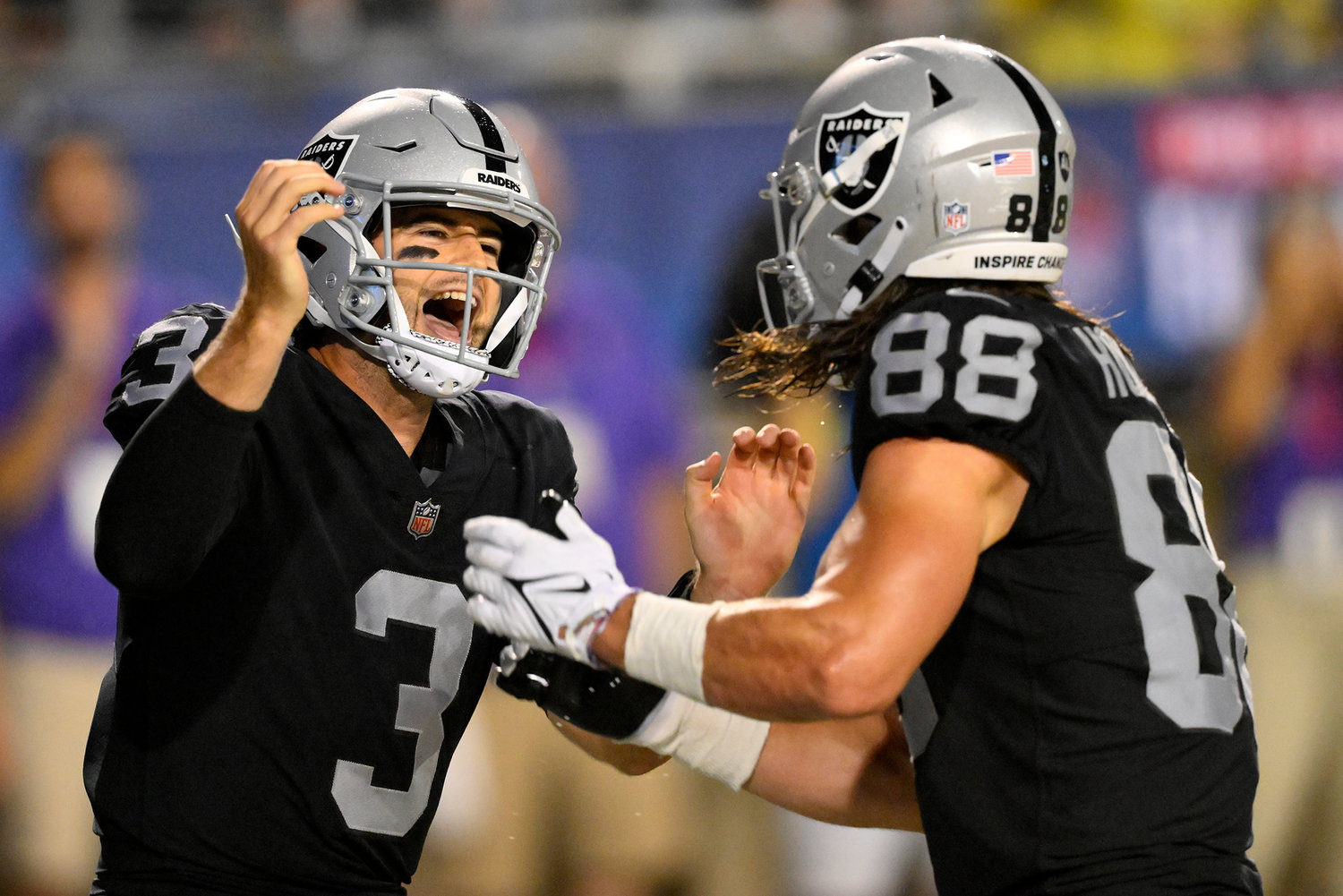 Las Vegas Raiders quarterback Jarrett Stidham (3) celebrates with tight end Jacob Hollister (88) after Stidham scrambled for a touchdown during the first half of the team's NFL football exhibition Hall of Fame Game against the Jacksonville Jaguars, Thursday, Aug. 4, 2022, in Canton, Ohio.