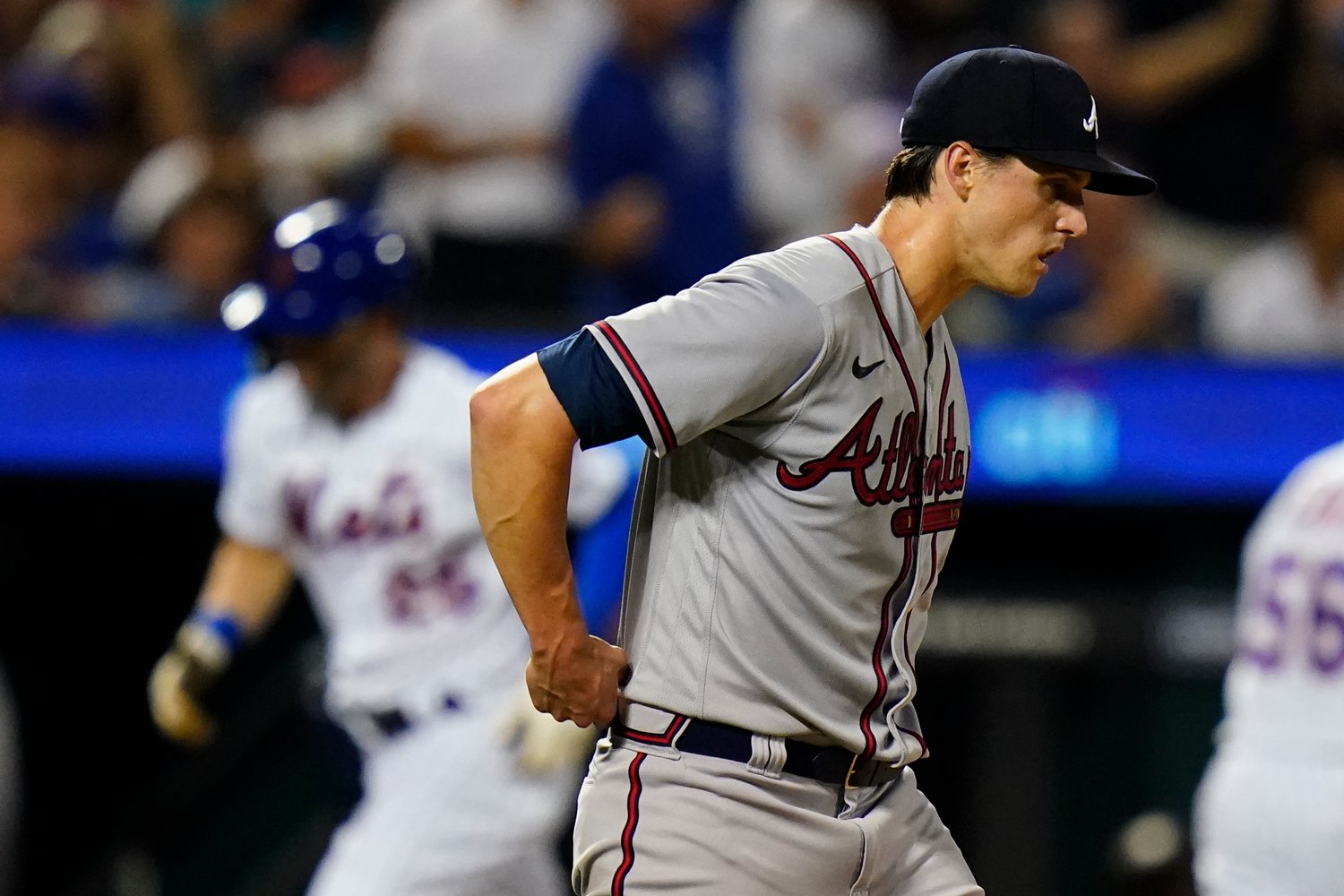 Atlanta Braves starting pitcher Kyle Wright waits as New York Mets' Tyler Naquin runs the bases after hitting a home run during the sixth inning of a baseball game Thursday, Aug. 4, 2022, in New York. (AP Photo/Frank Franklin II)