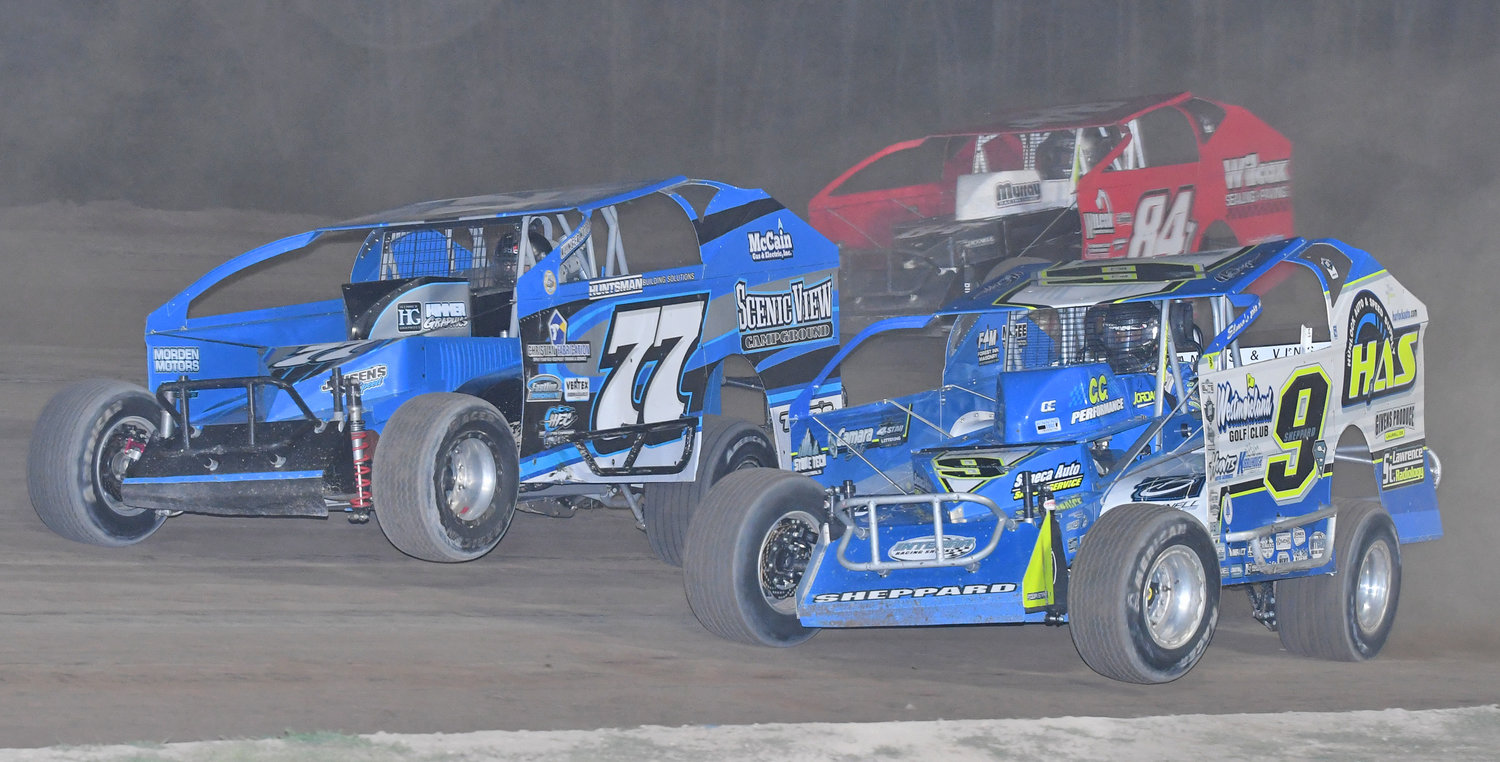 SHEPPARD WINS AGAIN — Utica-Rome Speedway action from last Friday night. Matt Sheppard of Savannah gets to the inside of No. 77 Alan Barker and No. 84Y Alex Yankowski on his way to his ninth feature win at the "Home of Heroes."