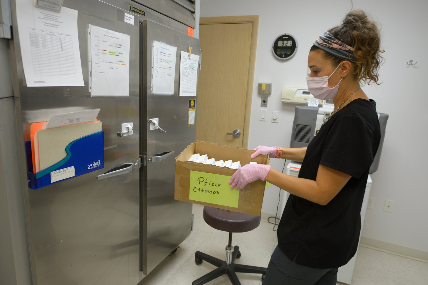 Janae Roland, a registered nurse at the Altoona Center for Clinical Research begins the process of preparing refrigerated doses of a new Lyme disease vaccine Friday, Aug. 5, 2022, in Duncansville, Pa. (AP Photo/Gary M. Baranec)
