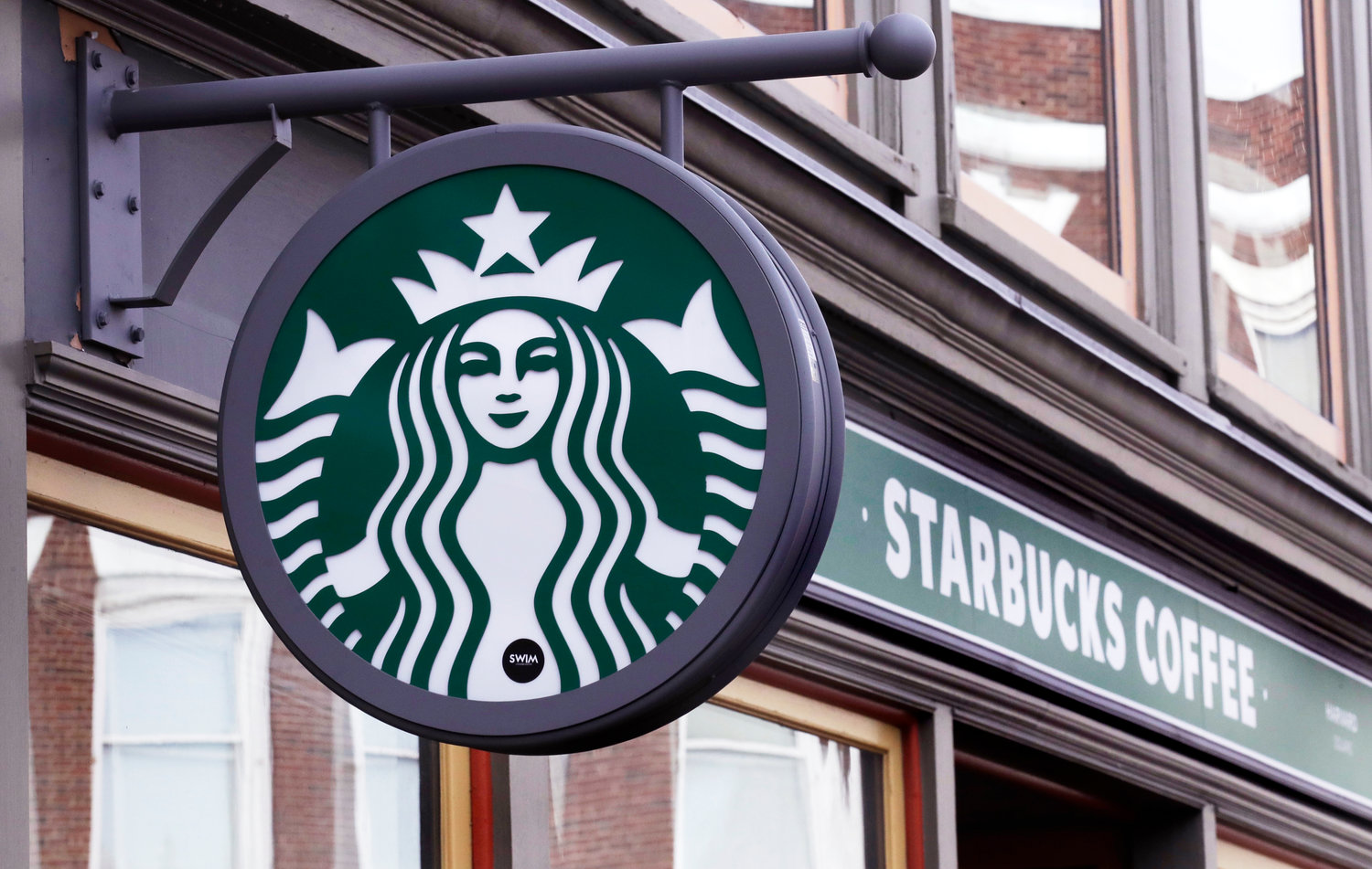 A sign for a Starbucks Coffee shop is pictured in Harvard Square in Cambridge, Mass., Dec. 13, 2018. The Seattle-based coffee giant said its revenue rose 9% to $8.2 billion during the April-June 2022 period, a quarterly record. That surpassed Wall Street’s forecast of $8.1 billion, according to analysts polled by FactSet.