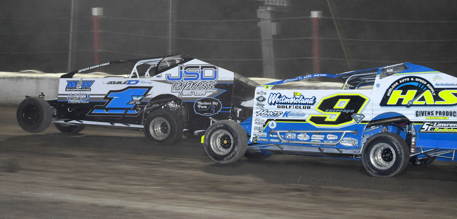 Vernon’s Willy Decker in the 1X tries to hold off Matt Sheppard of Savannah coming out of turn four, but couldn’t with Sheppard recording his fourth win in a row and 10th for the season in the modified division on Friday, Aug. 12 at Utica-Rome Speedway.