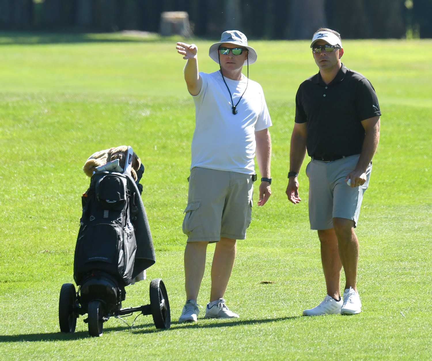 Aaron Fiorini, right, and his caddie John Zamperetti plan their approach shot on the par 5 15th hole on Sunday afternoon at McConnellsville Country Club during the final round of the Rome City Men’s Amateur Golf Championship. Fiorini finished second with a two-day score of 154. Fiorini won the 2019 city title, while Zamperetti took the crown in 2003 and 2005.