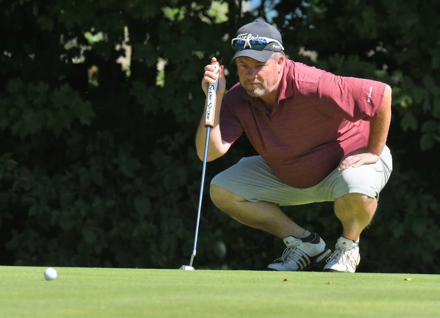 Mark Powonsky lines up a putt on the par 5 15th hole on Sunday afternoon at McConnellsville Country Club during the final round of the Rome City Men's Amateur Golf Championship. Powonsky finished 13th with a two-day score of 165.