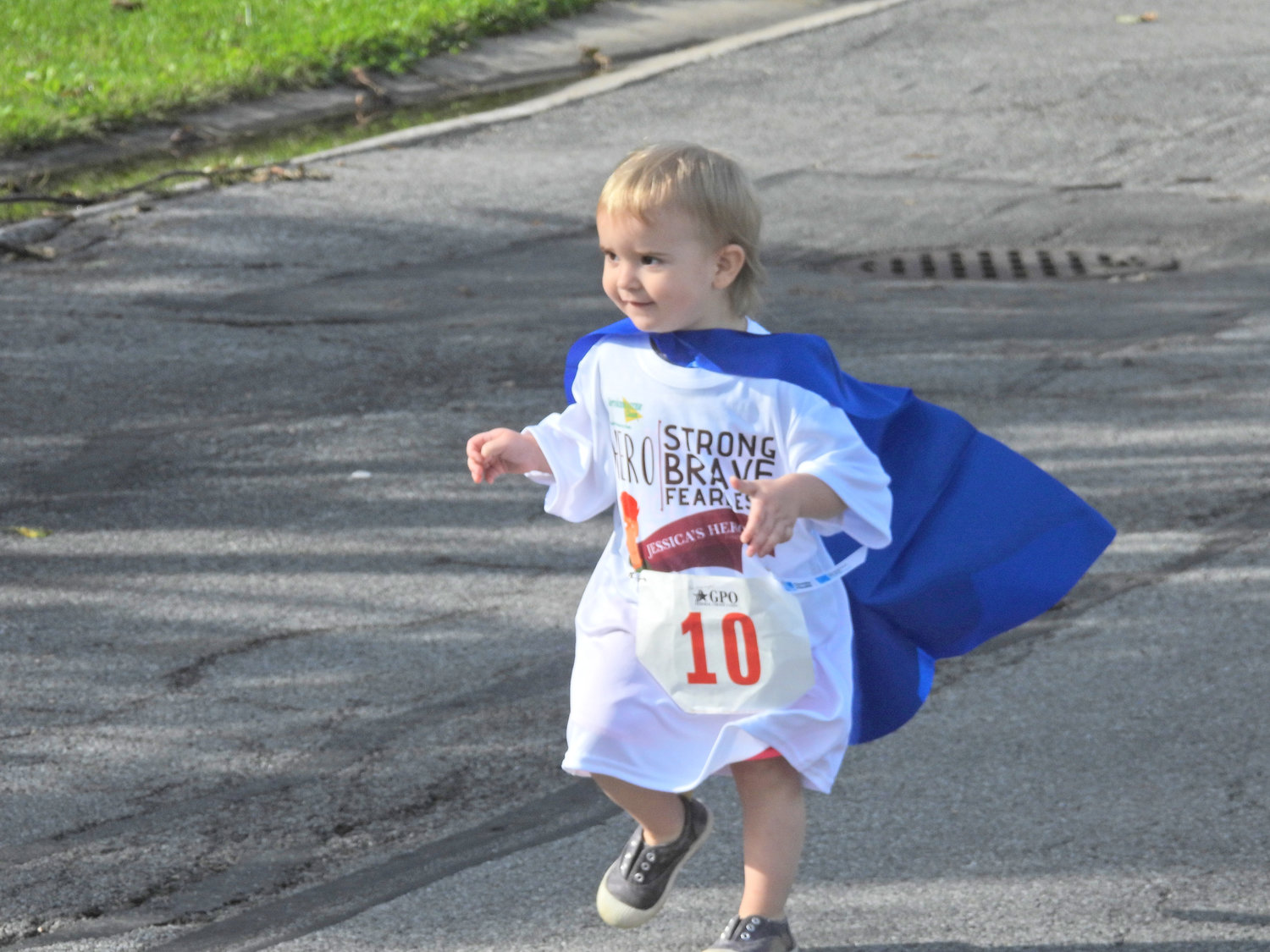 A young child takes off running for Jessica’s Heroes 5K Walk and Run, helping raise awareness and support for those in the community fighting cancer at the 2021 Jessica’s Heroes.