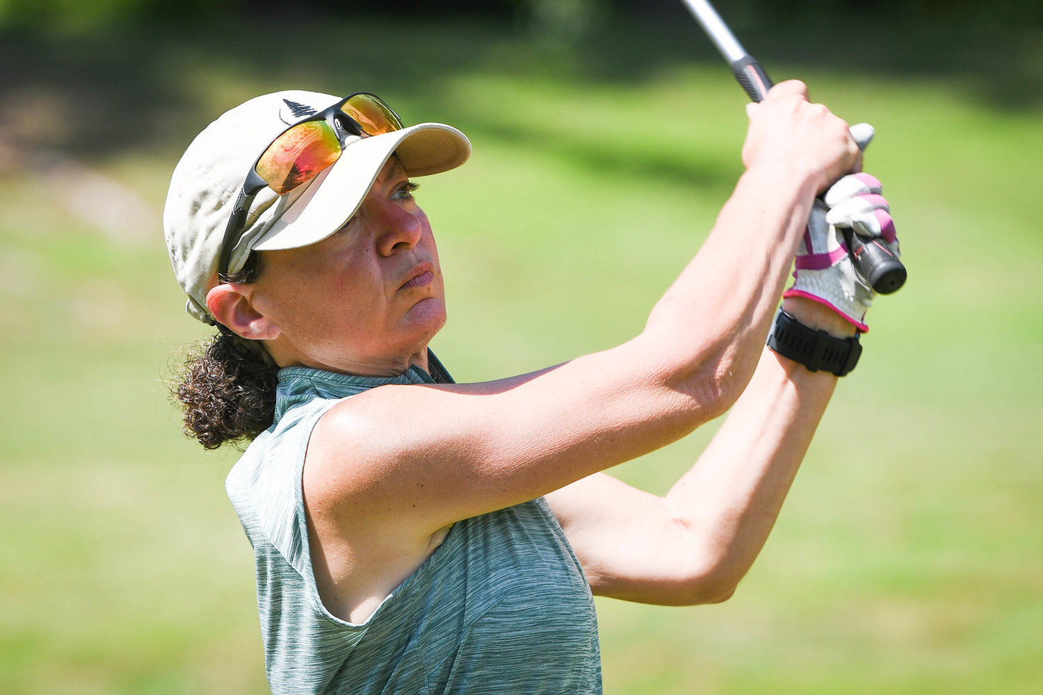 Kathy Garbooshian watches her shot in the Rome City Women’s Amateur Golf Championship on Monday at Rome Country Club.