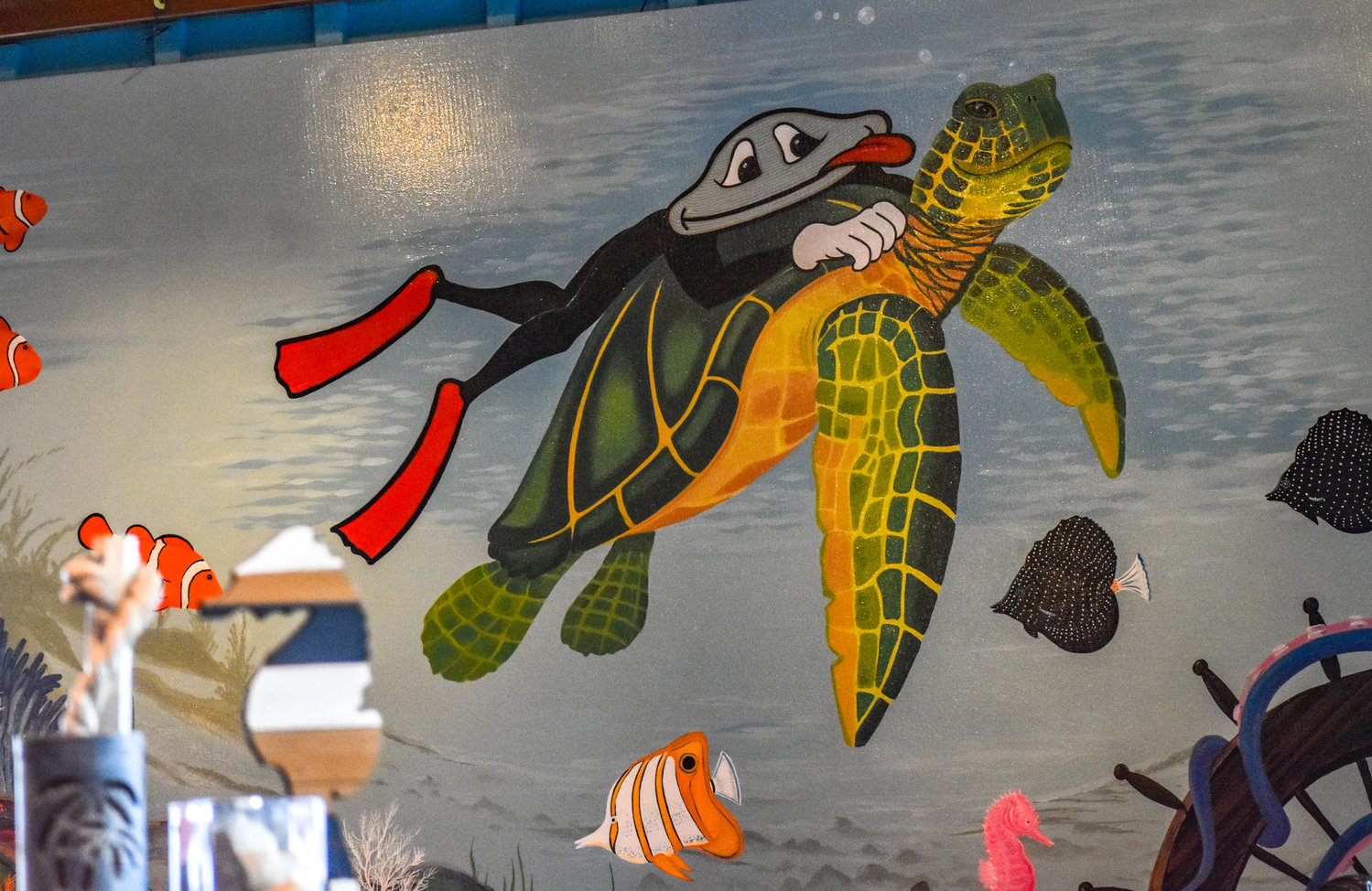 A mural inside the Crazy Clam in Sylvan Beach features the restaurant's iconic clam mascot