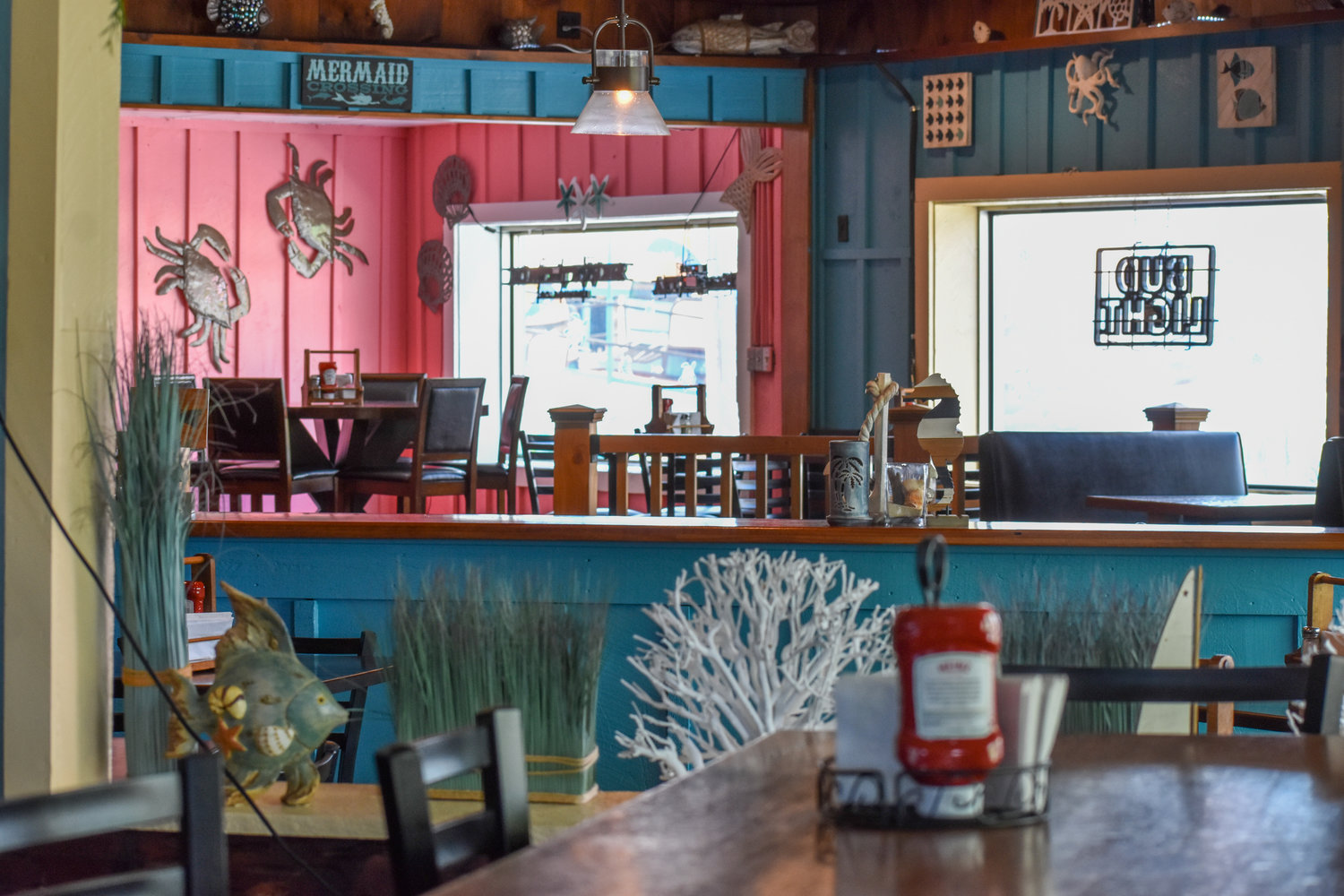 The interior of the Crazy Clam has been refreshed with new paint and beach-themed decor.