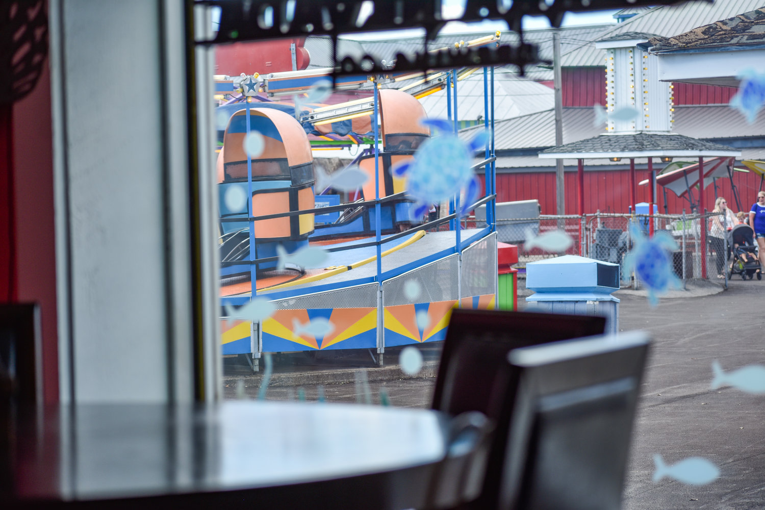 Rides at the Sylvan Beach Amusement Park can be seen next door while dining at the Crazy Clam.