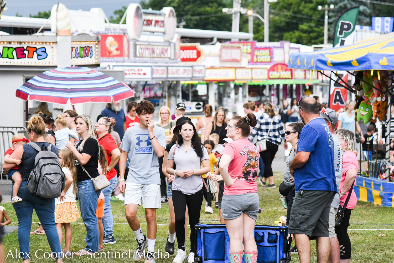 Fairgoers visit the Herkimer County Fair in Frankfort on Thursday.