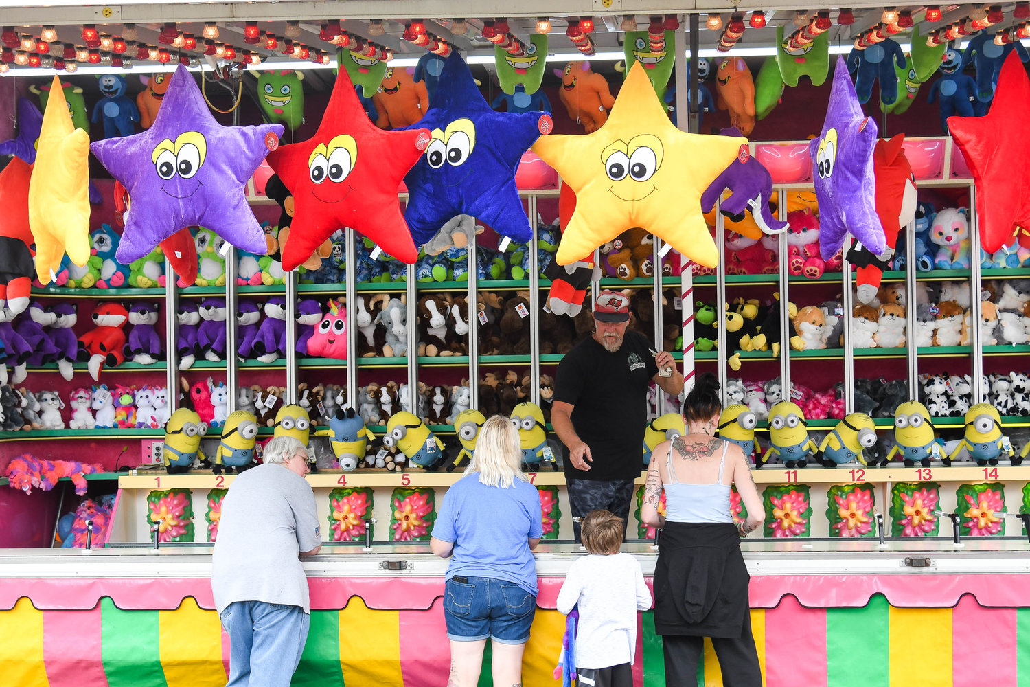 Fairgoers play games on Thursday at the Herkimer County Fair in Frankfort.