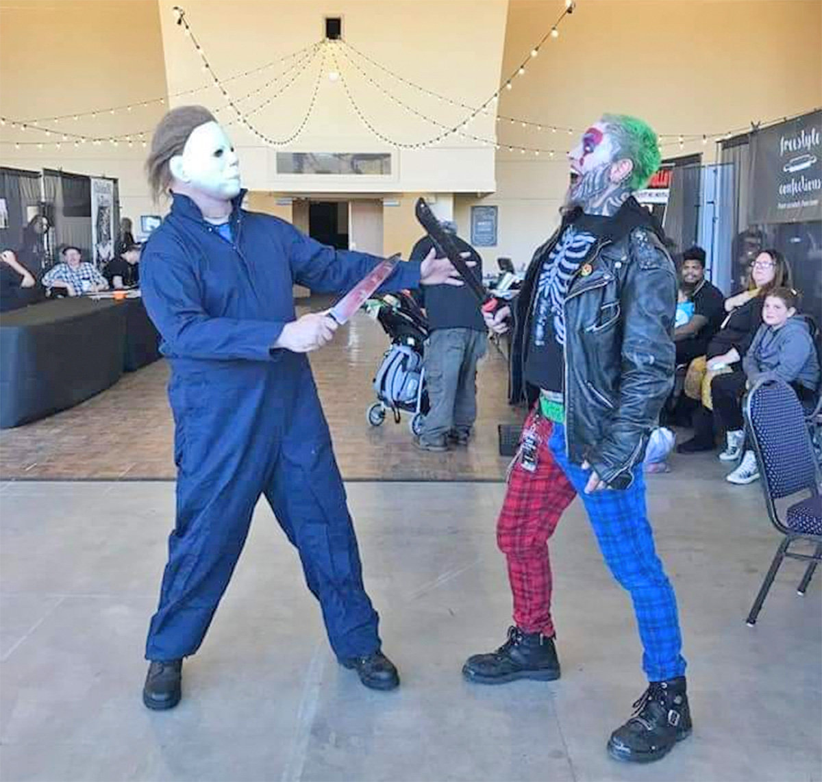 Sci-Fi Horror Fest attendees meet as costumed horror icons on the floor of a previous convention.
