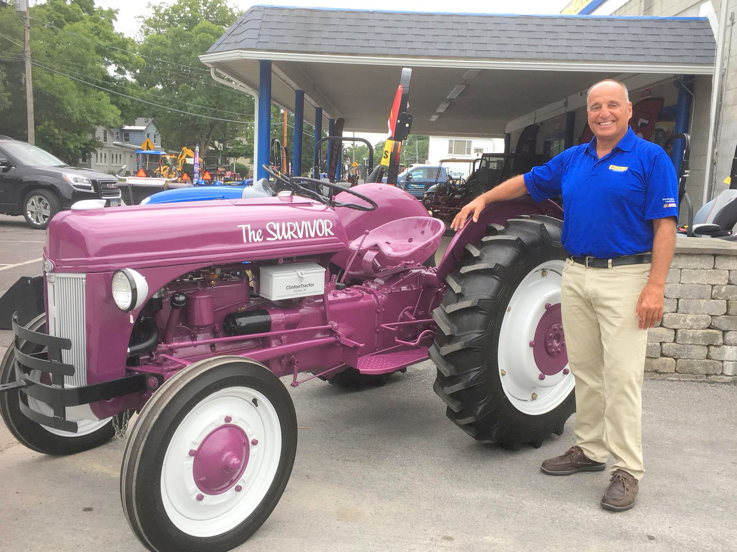 John Calidonna, co-owner of Clinton Tractor, pictured with the Survivor Tractor.