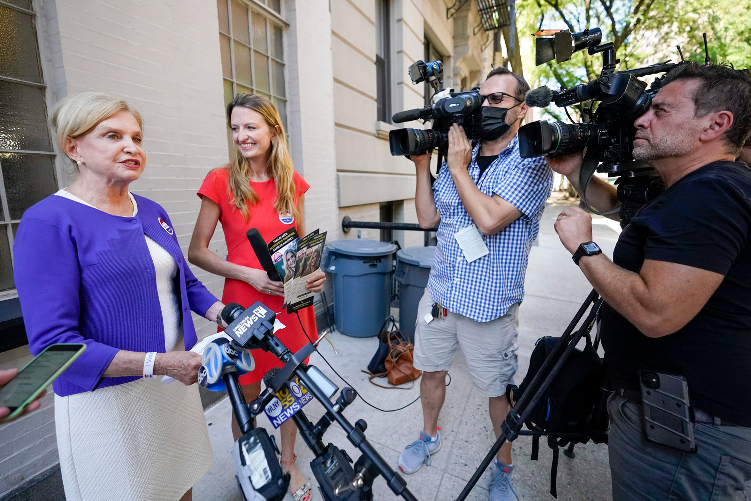 Rep. Carolyn Maloney, left, with her daughter Virginia talks to reporters after casting her vote in the Democratic primary election, Aug. 18, 2022, in New York. Maloney is running against attorney Suraj Patel and Rep. Jerry Nadler in New York's 12th Congressional District Democratic primary. (AP Photo/Mary Altaffer, File)