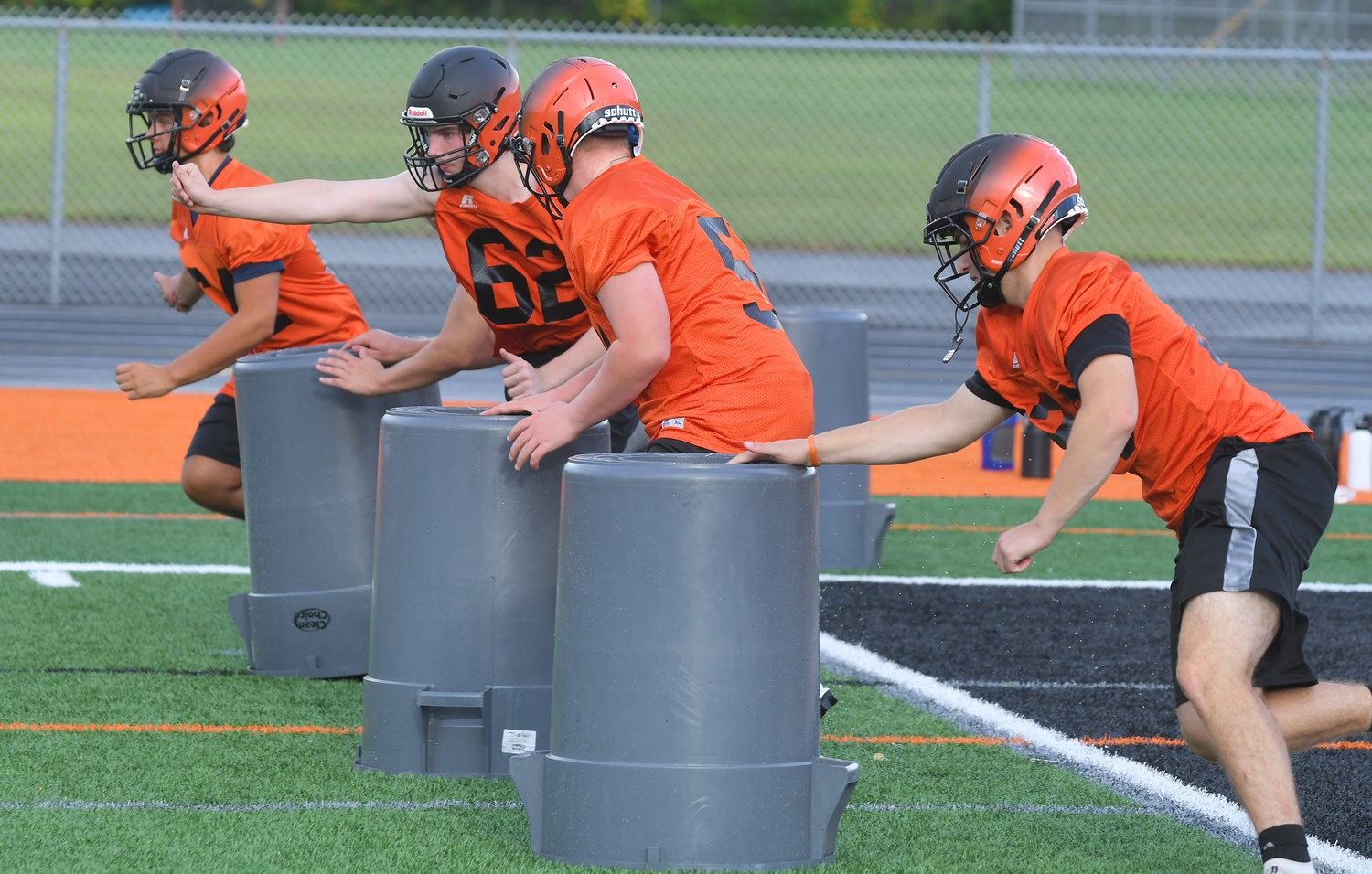 Rome Free Academy linemen practice their assignments during practice on Monday evening at RFA Stadium. The Black Knights will open the season at 6:30 p.m. on Friday, Sept. 2 at home against New Hartford.