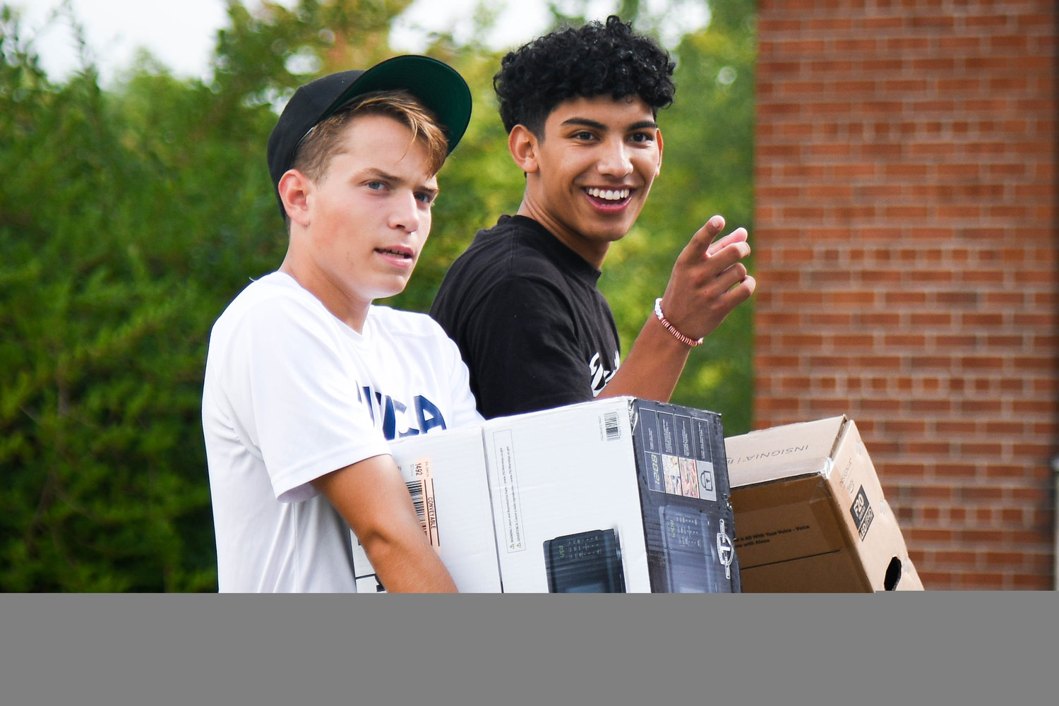 Bruce Oremus and Brennyn Ordonez help Utica University’s Class of 2026 move into their dorms on Tuesday.