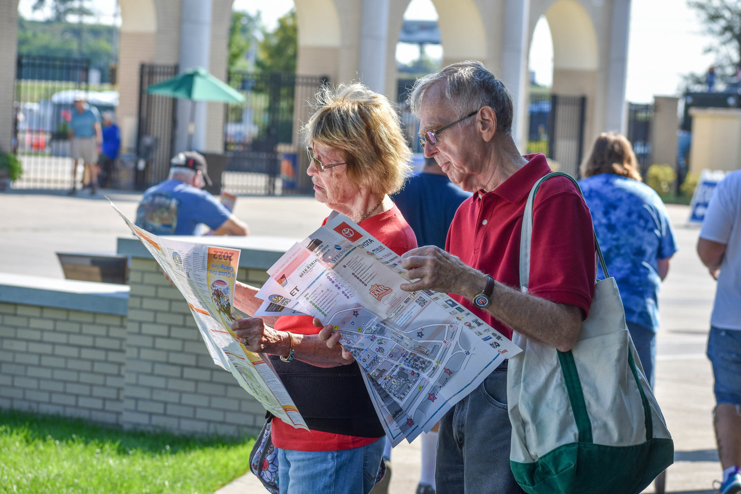 Upon entering, fairgoers unravel the visitor map for the 2022 New York State Fair.