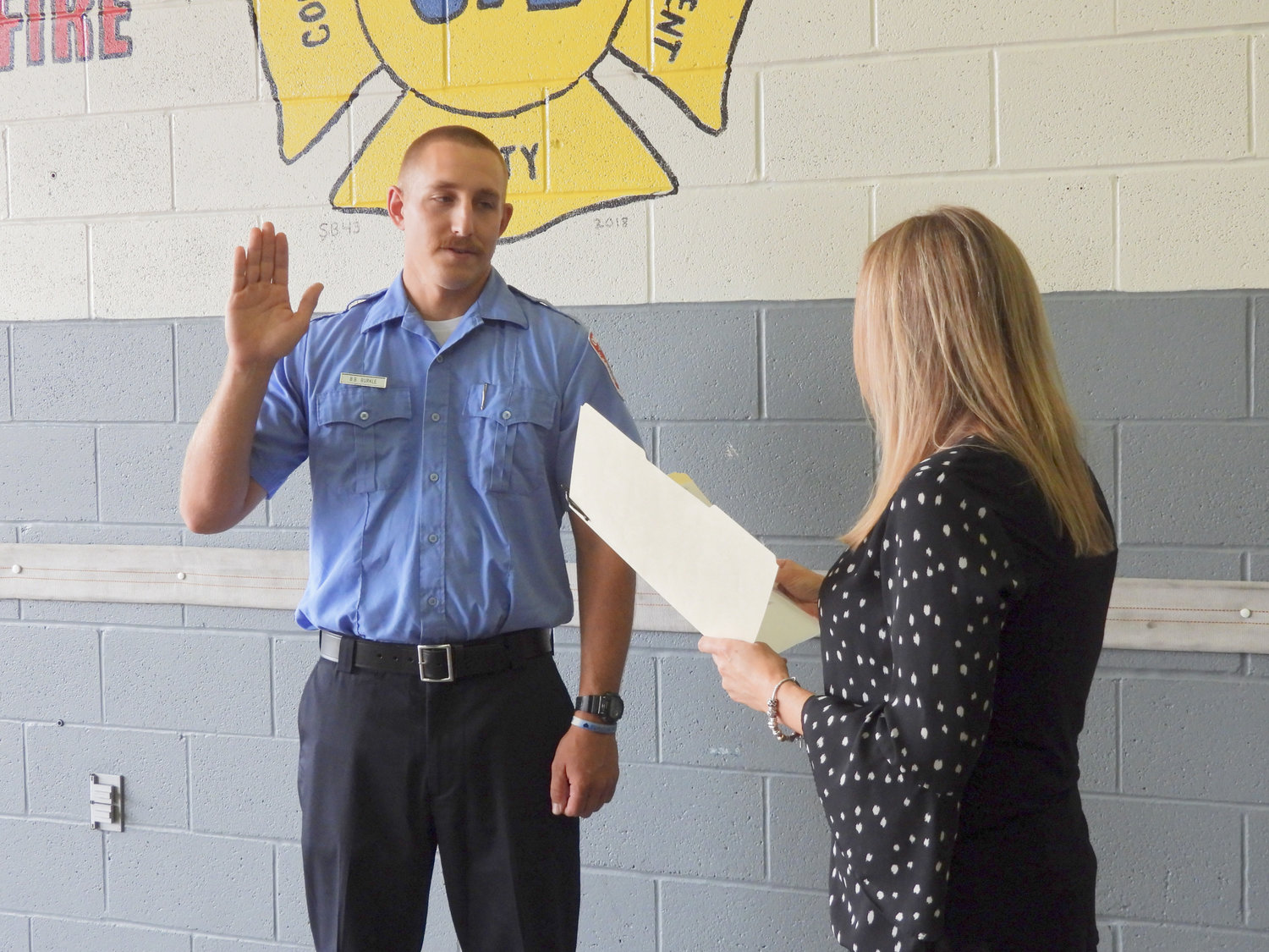 Brian Burkle is sworn in as lieutenant at the Oneida Fire Department at a ceremony on Friday, Aug. 26.