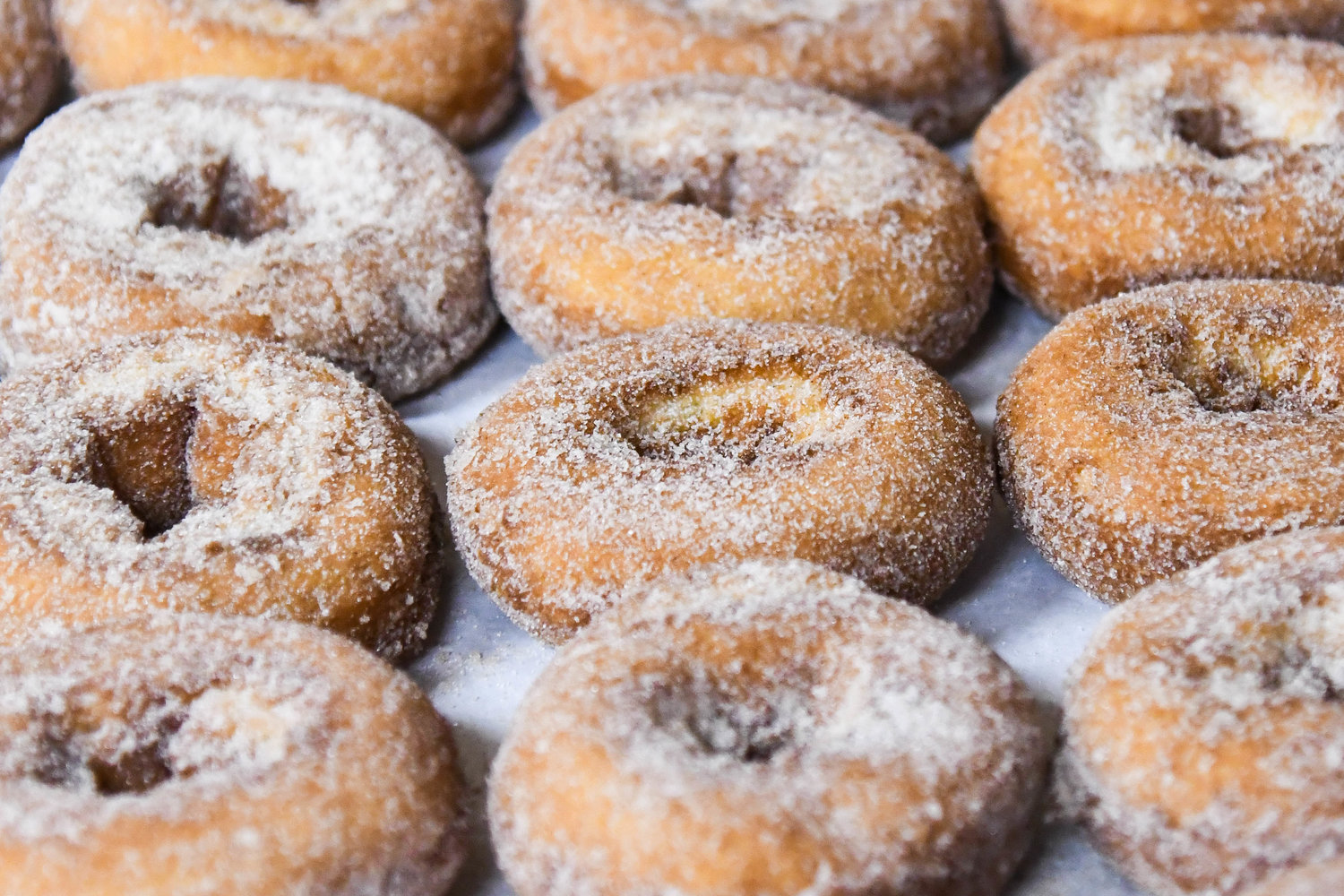 Fresh cider donuts are prepared in the kitchen at Clinton Cider Mill on Friday.