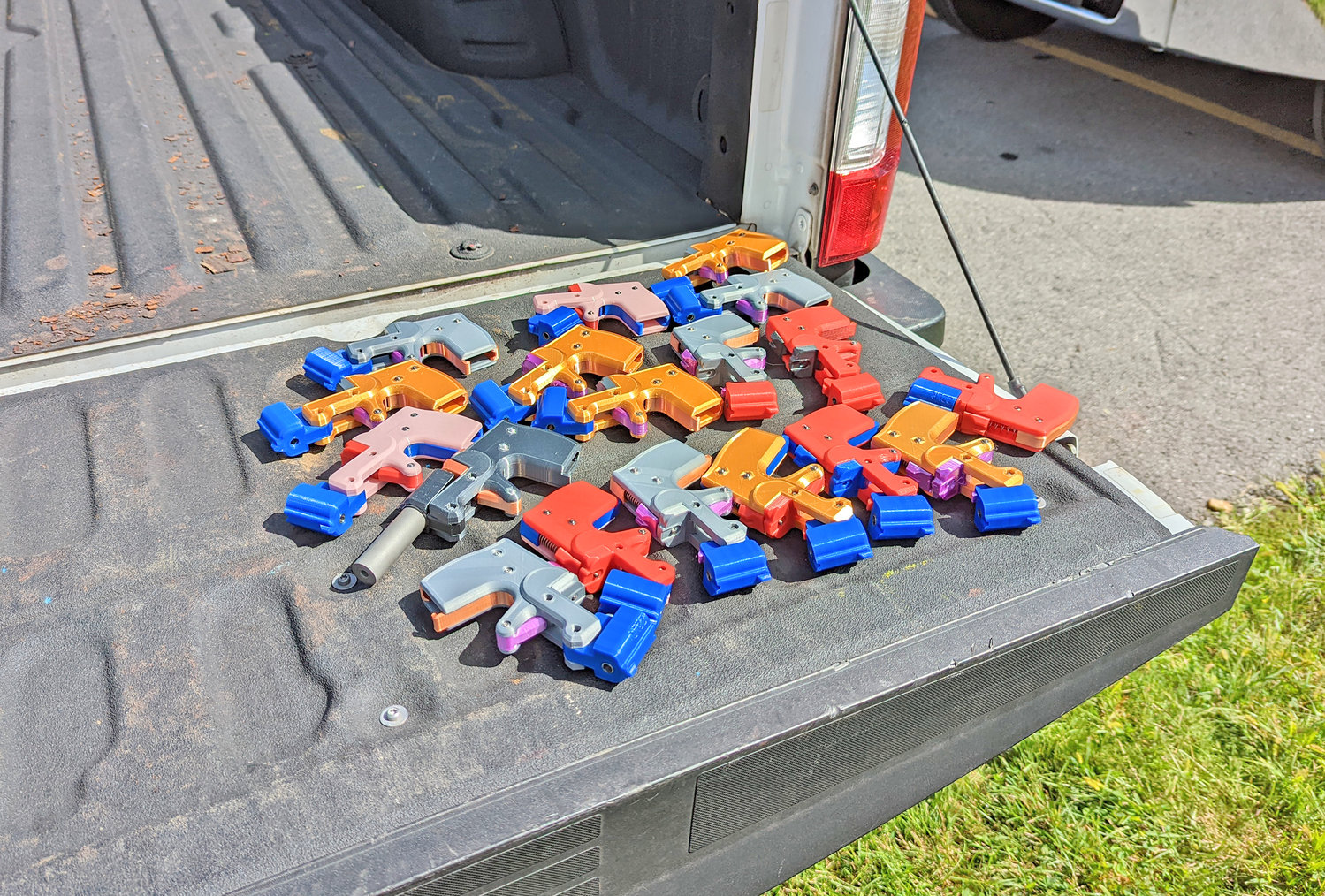A collection of ghost gun parts collected by law enforcement at the gun buyback event in Utica on Saturday. The toy-like pieces are used to assemble homemade handguns.