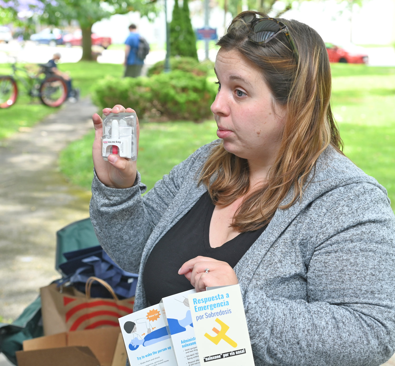 Lauren Davie, director of programming at BRiDGES, demonstrates how to administer Narcan at Higinbotham Park in Oneida during Overdose Awareness event.