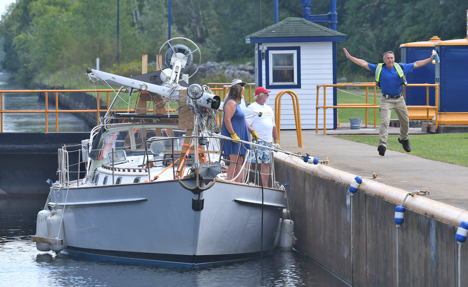 Daniel Vilovchik, Lockmaster of Lock 21 in New London does a little dance for the camera as he greets passengers aboard the Moon Rise, which was heading west through the lock Monday, Aug. 29. Vilovchik, from Belarus, found the people on the boat were Ukrainian and headed from their home in Maryland to Toronto, Canada. While few folks will be traveling by boat for Labor Day weekend, millions will be heading out one last time before fall by car or airplane.