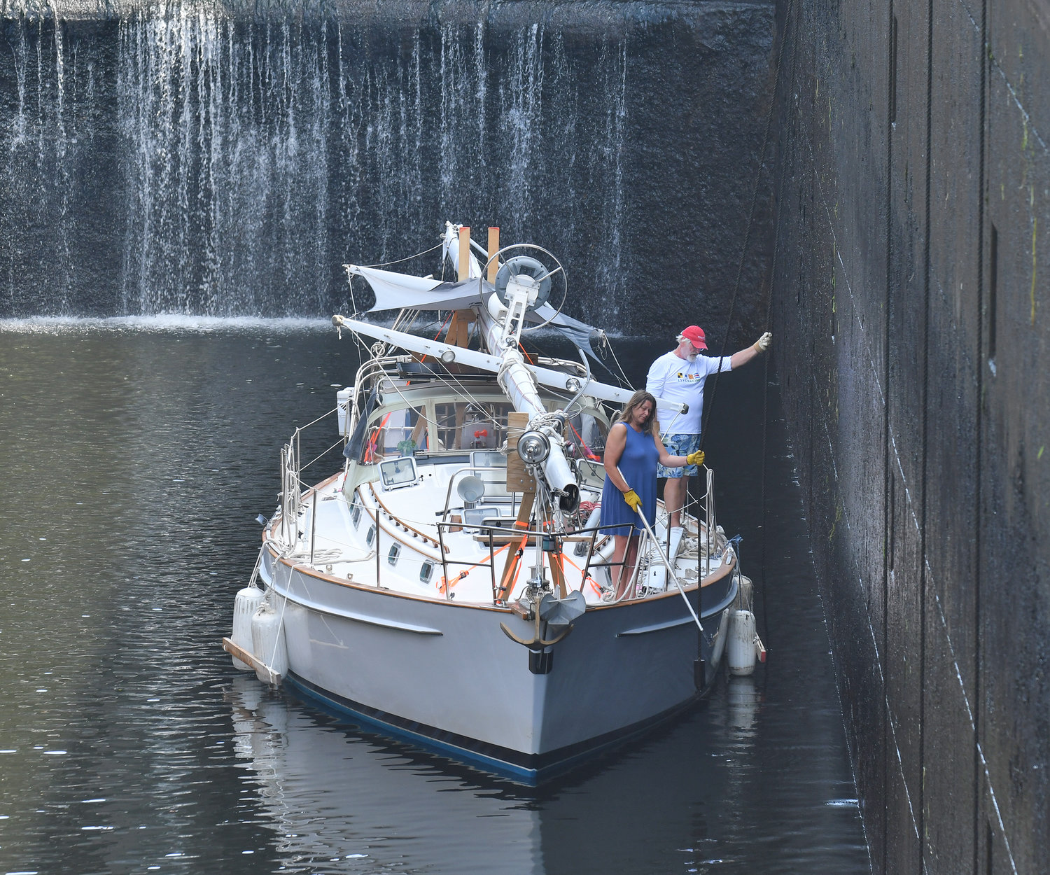 A couple from Maryland keep their sailboat Moon Rise off the south wall of Lock 21 in New London, Monday, Aug. 29.