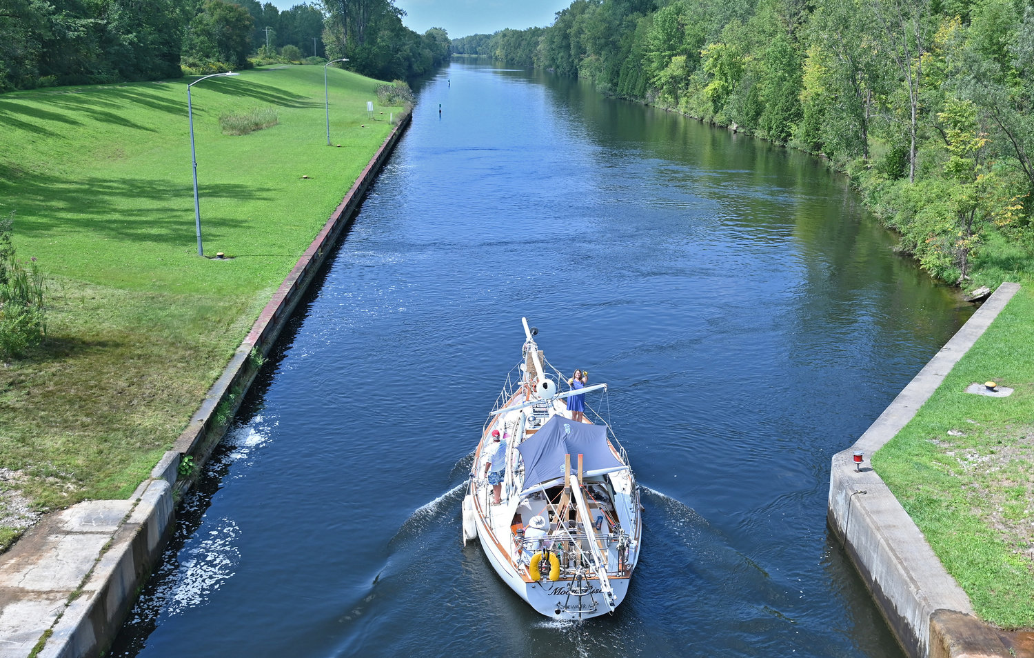 The Moon Rise goes west on the Erie Canal after clearing Lock 22 in New London Monday, Aug. 29. The couple, from Maryland, are heading to Toronto, Canada.