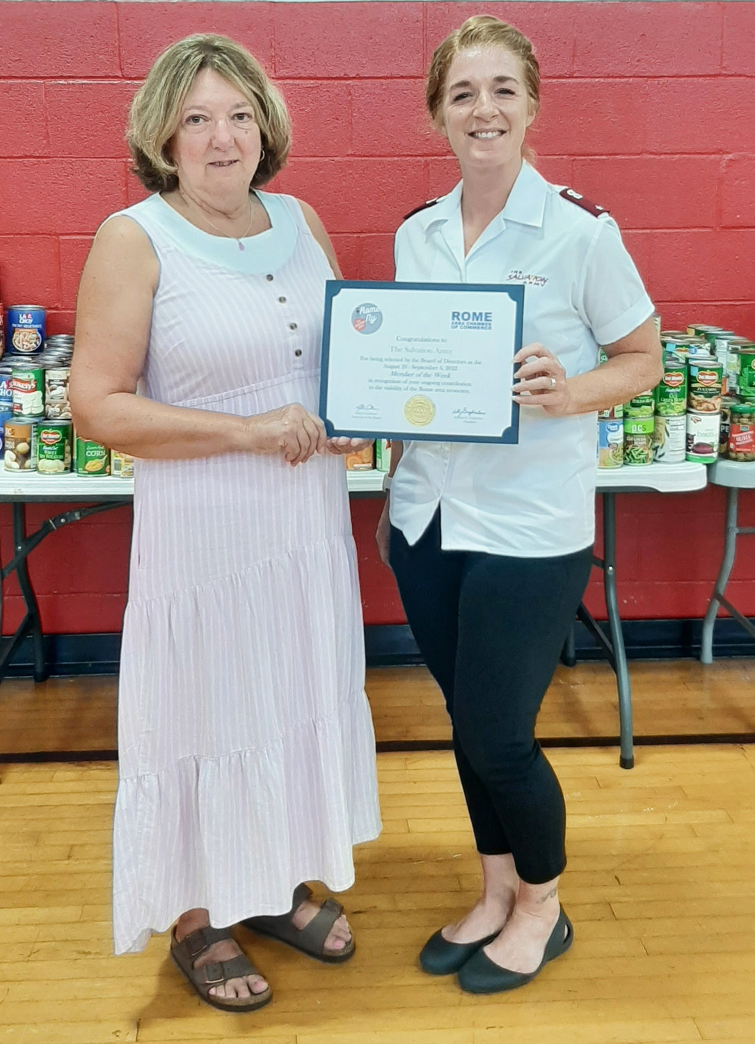 Suzanne Carvelli, president of the Rome College Foundation and representative of the Rome Chamber of Commerce Membership Committee, left, presents Lt. Tabitha Swires, co-commanding officer at the Salvation Army’s Rome Citadel, with a congratulatory certificate honoring the Salvation Army as the Rome Area Chamber of Commerce Member of the Week.
