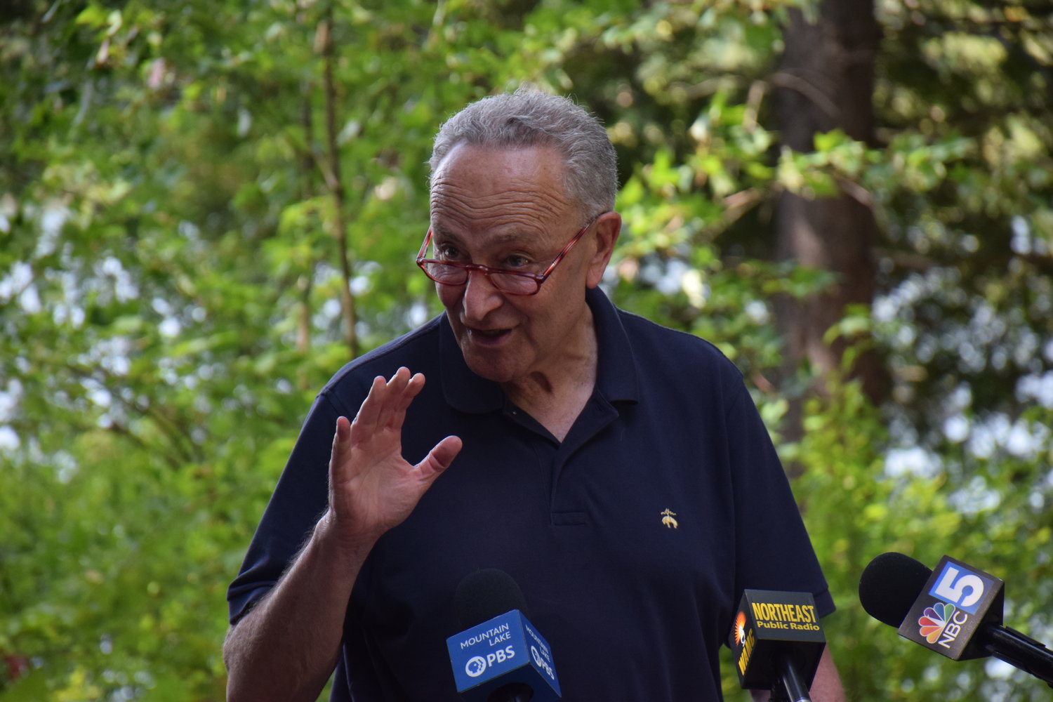 U.S. Sen. Chuck Schumer discusses the Inflation Reduction Act of 2022 at Heart Lake in Lake Placid on Monday, specifically highlighting how the act could benefit the climate and economy in the Adirondacks.