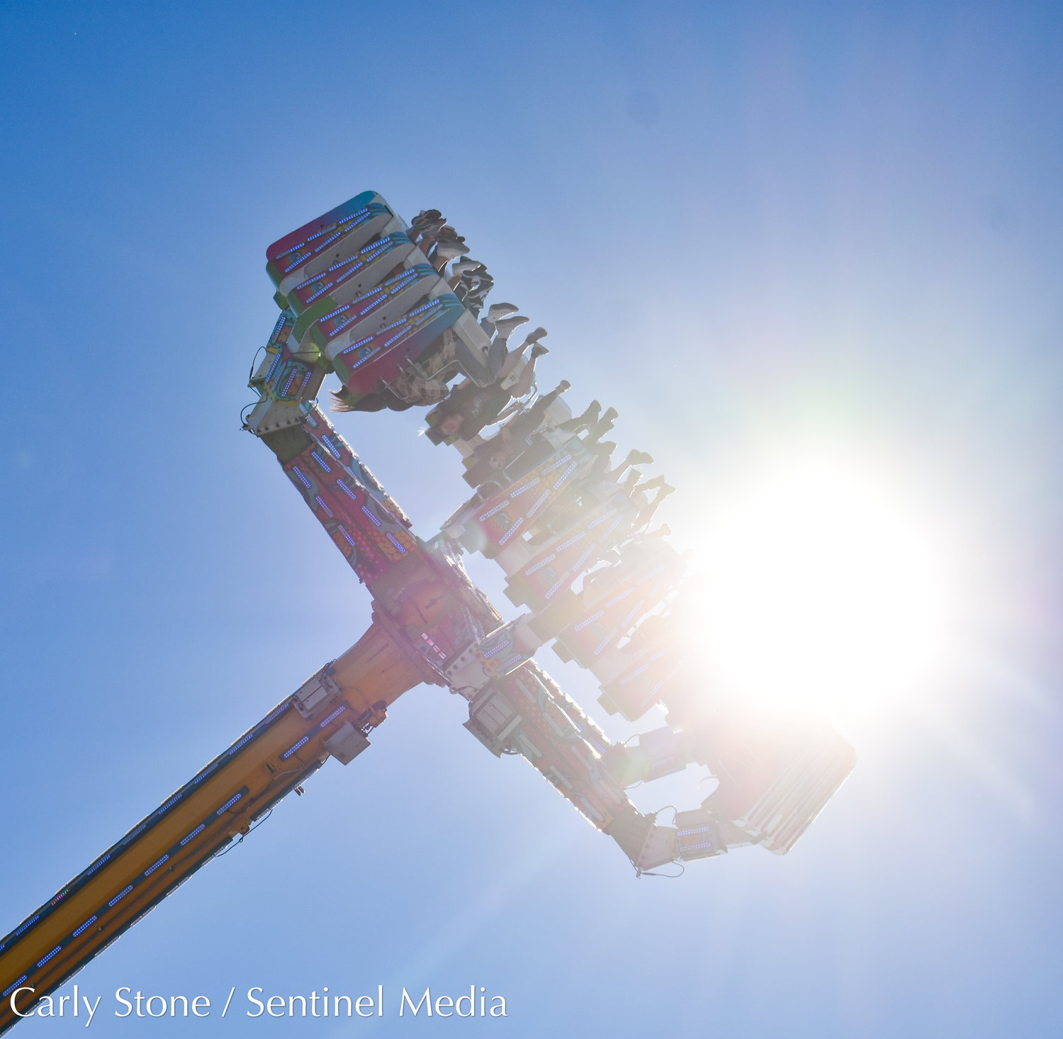 Riders get a thrill swinging high up with the sun on this ride found along the 2022 state fair midway.