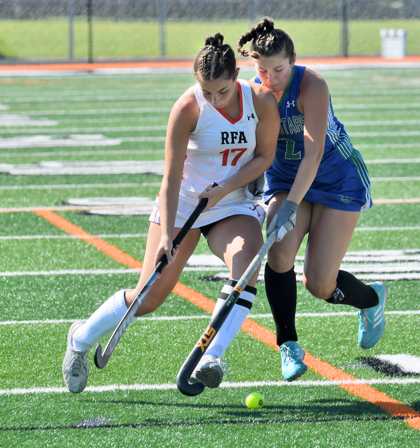 Rome Free Academy's Alyssa Nardslico works up the field defended by Cicero-North Syracuse's Maddi Brefka during the first half of the Black Knights' season opener at RFA Stadium Friday. The Black Knights lost 5-0.