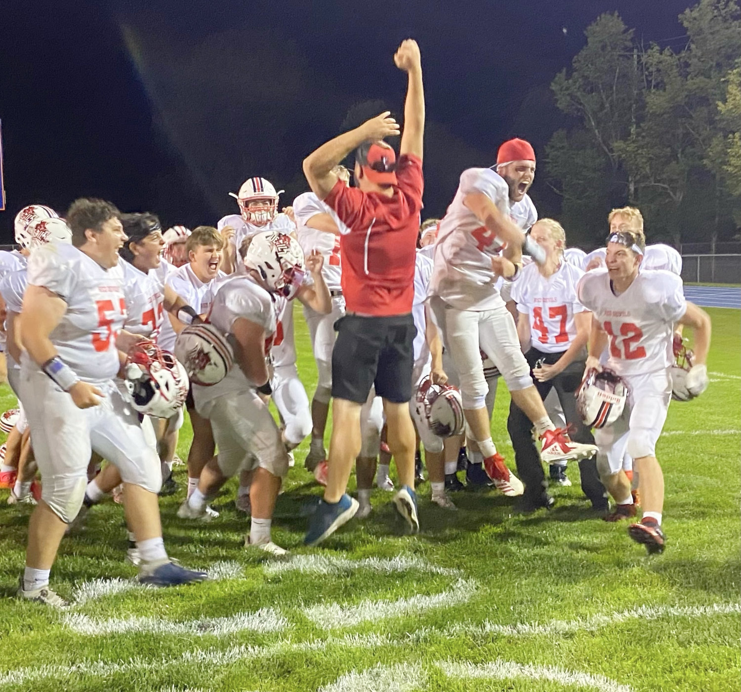 The Vernon-Vernona-Sherrill football team celebrates after a 14-0 victory over host Oneida on Friday. It was the 72nd meeting between the rivals.