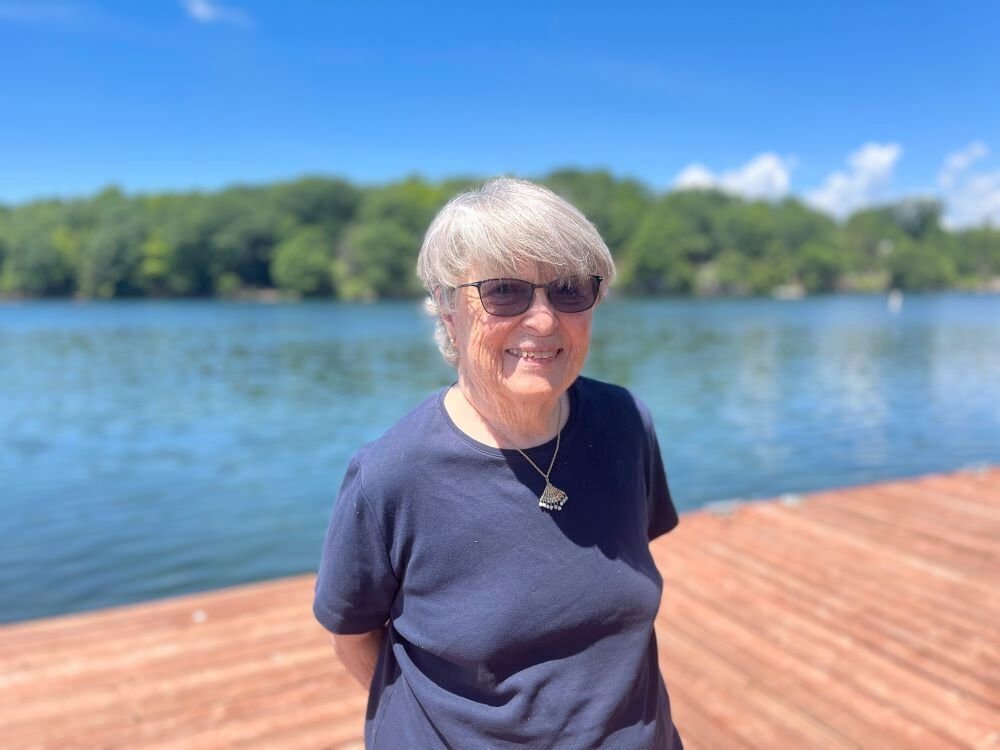 Susie Smith on her dock in the Thousand Islands. Photo by Emily Russell, NCPR